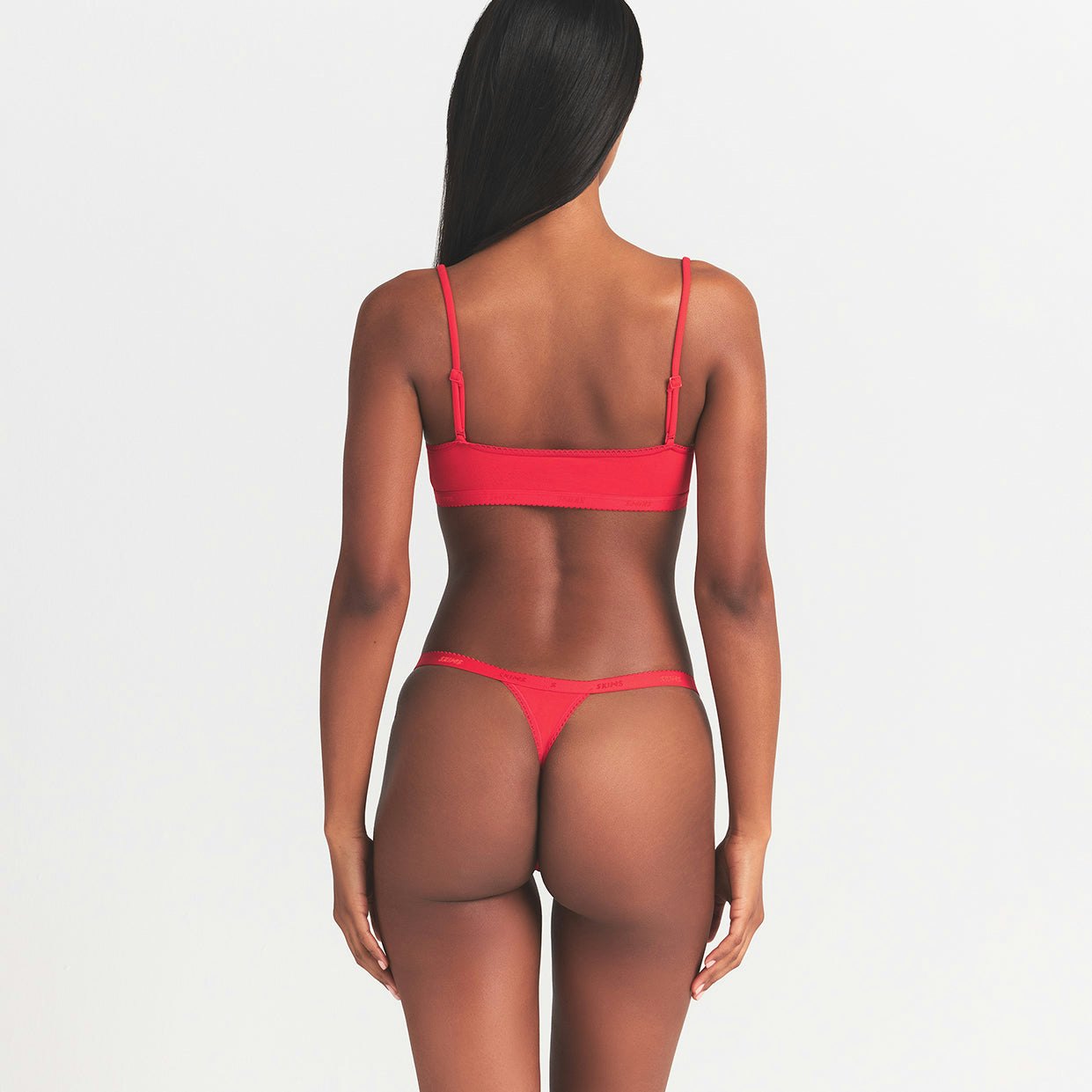 LIGHTWEIGHT COTTON LOGO PICOT THONG | RUBY TONAL ON A MODEL BACK VIEW @ | FOCUS: 0.0, 1.0, 0.9