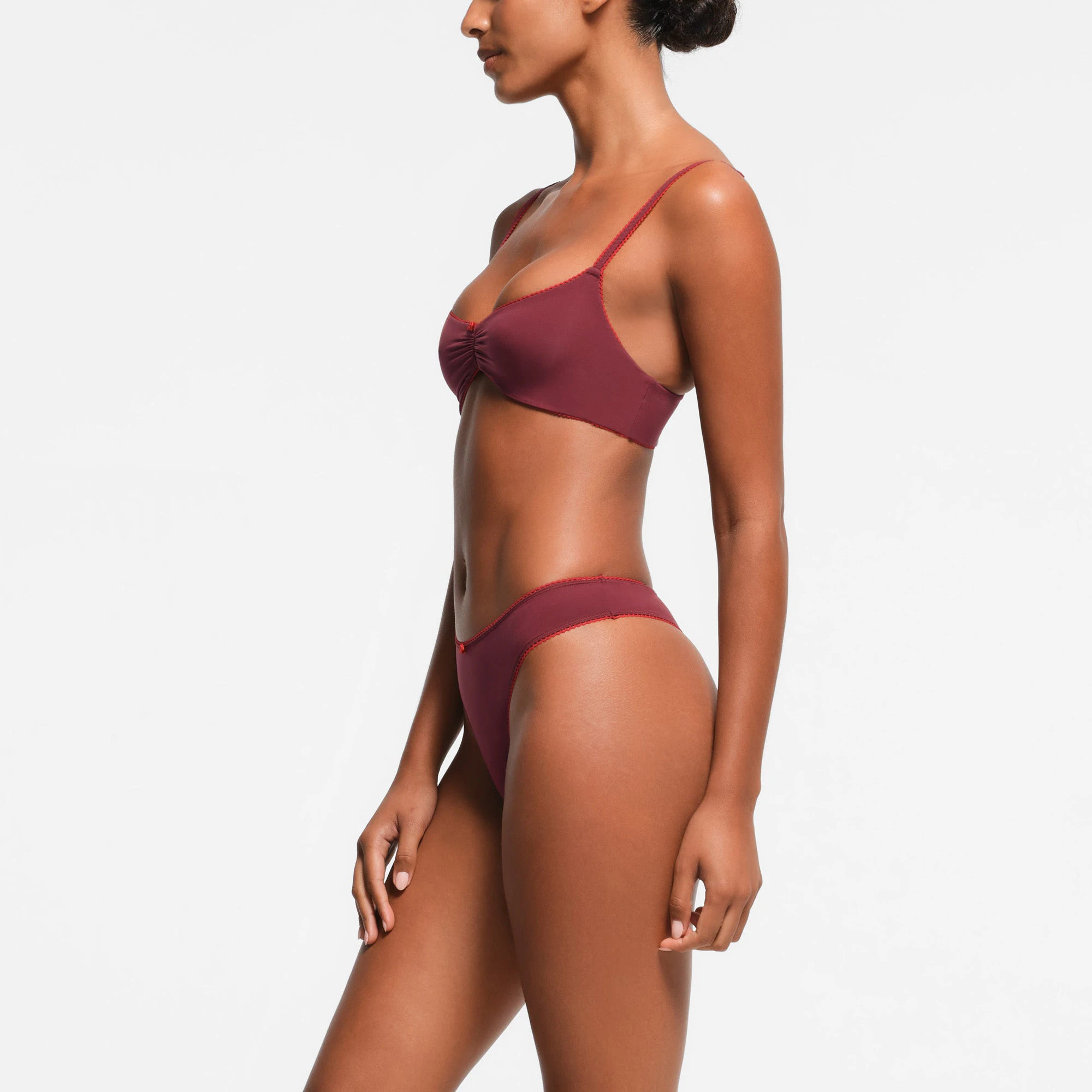 FITS EVERYBODY PICOT TRIM THONG | WINE CONTRAST ON A MODEL SIDE VIEW