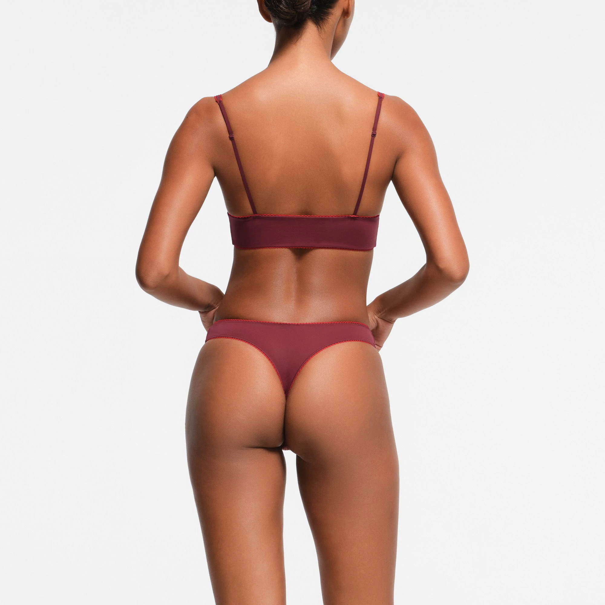 FITS EVERYBODY PICOT TRIM THONG | WINE CONTRAST ON A MODEL BACK VIEW