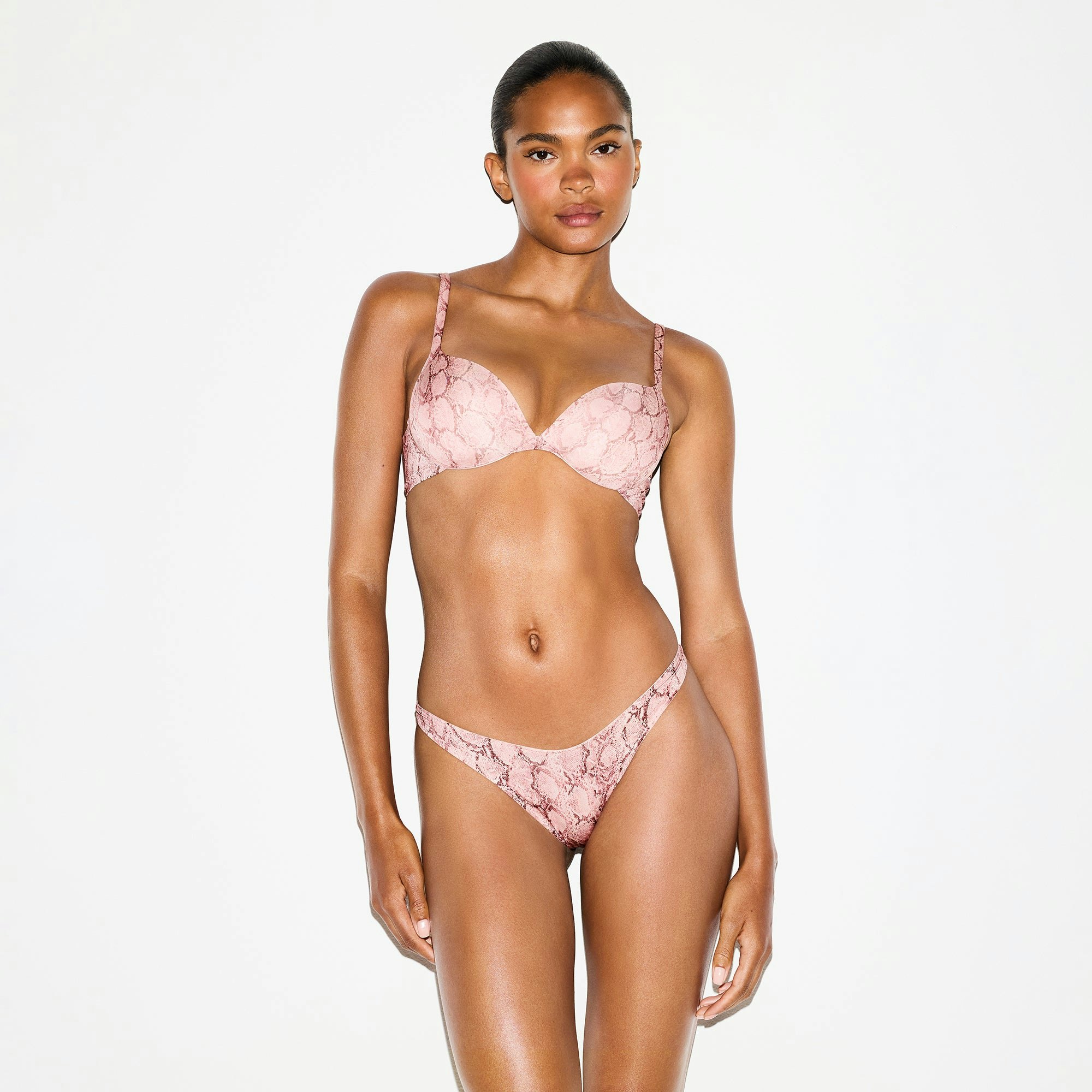 SHINE FOUNDATIONS DIPPED THONG | ROSE PASTEL SNAKE PRINT ON A MODEL FRONT VIEW @ | FOCUS: 0.0, 1.0, 0.9