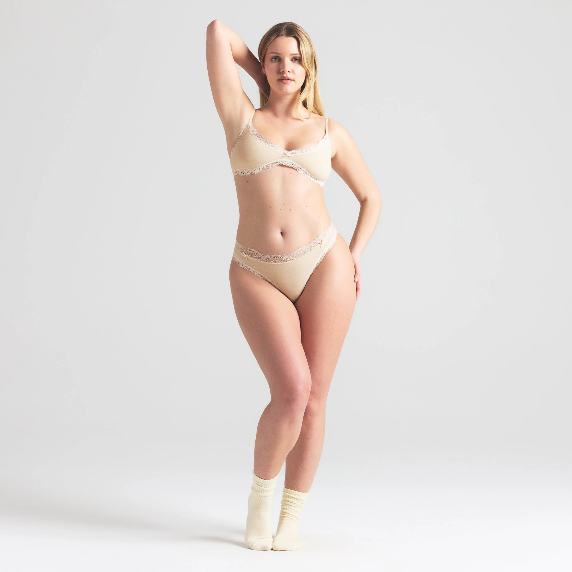 COTTON JERSEY LACE THONG | BUTTER ON A MODEL FRONT VIEW | FOCUS: 0.0, 1.0, 0.9