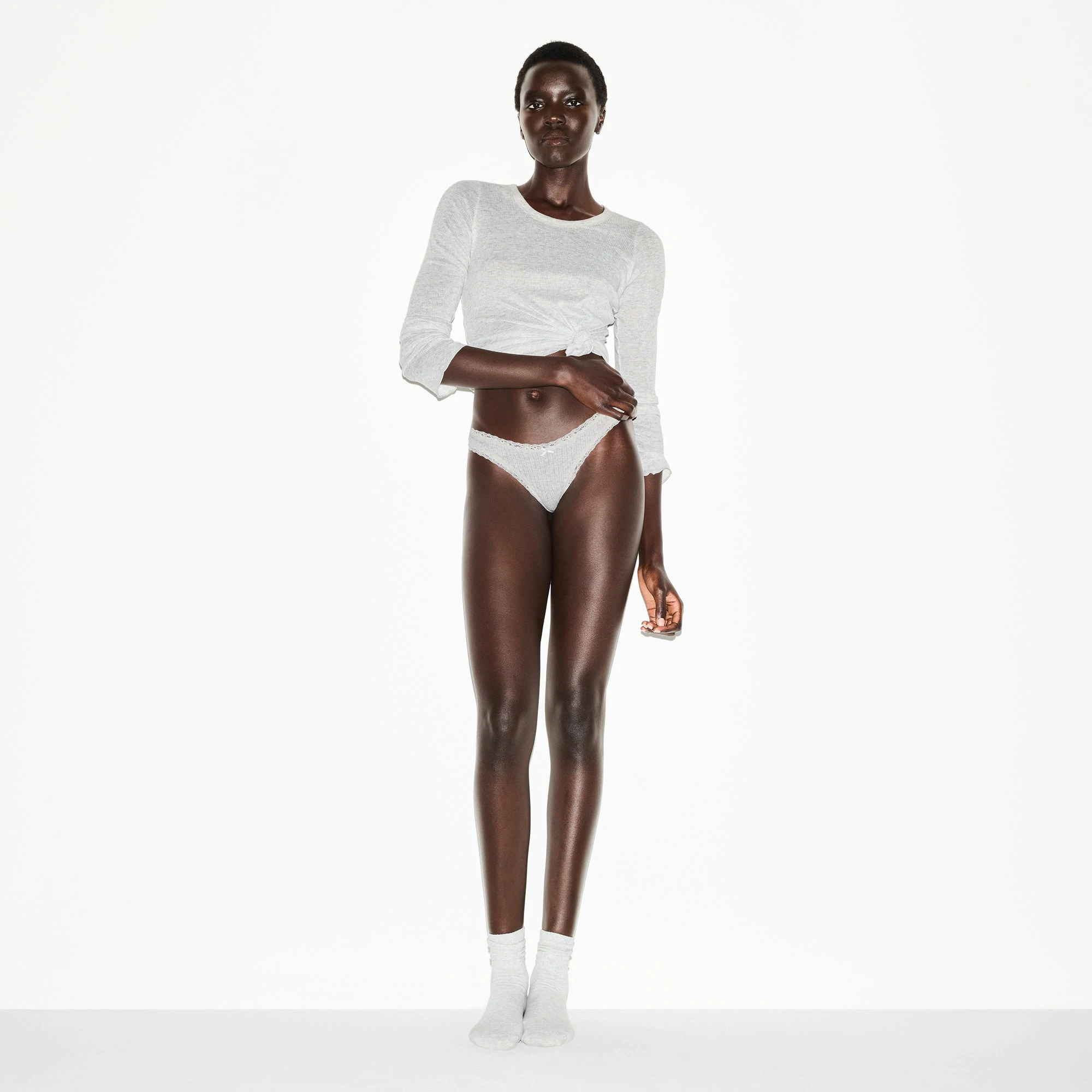 LIGHTWEIGHT COTTON POINTELLE LACE THONG | LIGHT HEATHER GREY ON A MODEL FRONT VIEW @ | FOCUS: 0.0, 1.0, 0.9