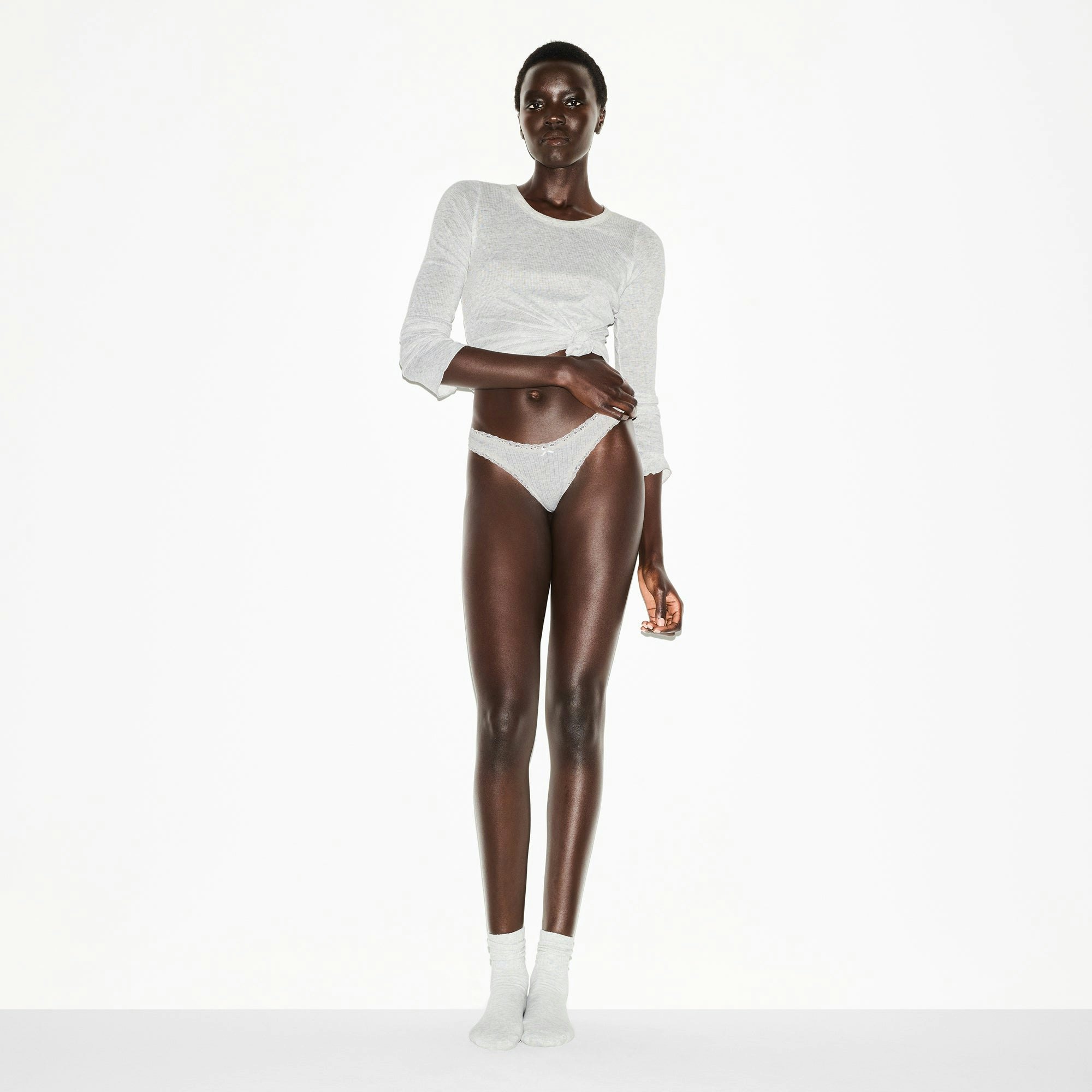 LIGHTWEIGHT COTTON POINTELLE LACE THONG | LIGHT HEATHER GREY ON A MODEL FRONT VIEW @ | FOCUS: 0.0, 1.0, 0.9