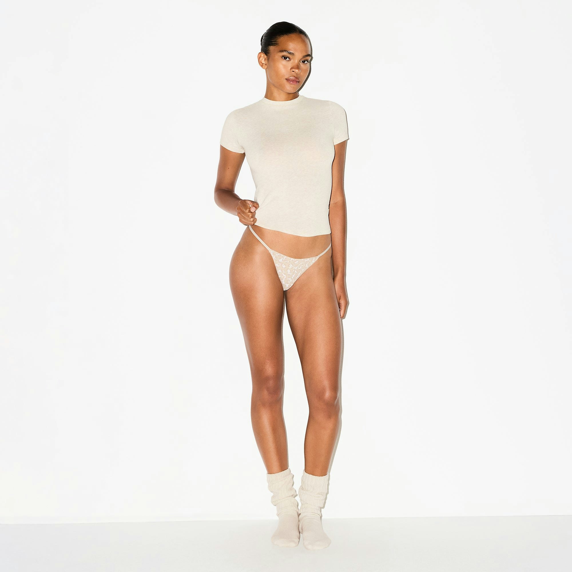 LIGHTWEIGHT COTTON STRING THONG | DELTA LEOPARD ON A MODEL FRONT VIEW @ | FOCUS: 0.0, 1.0, 0.9