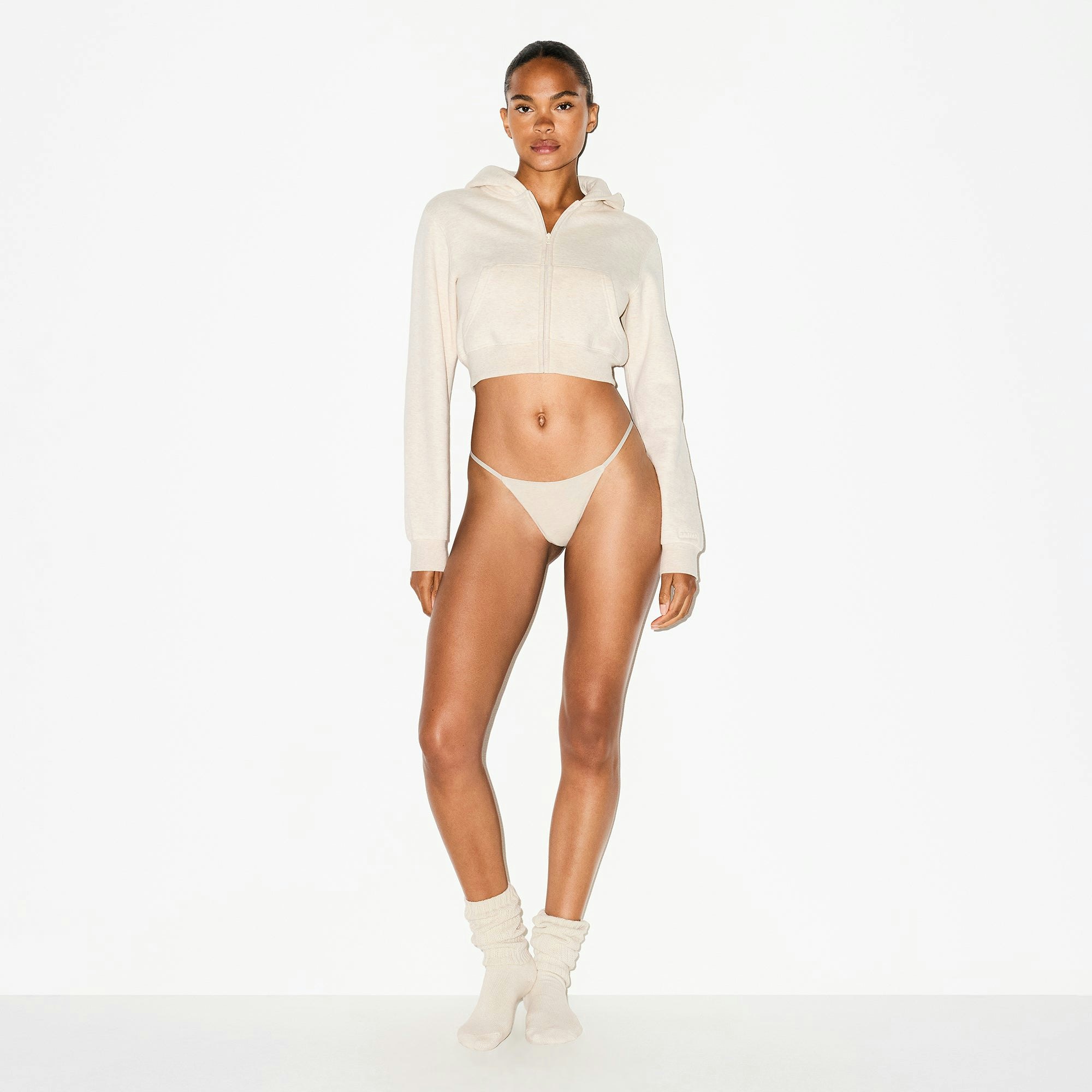 LIGHTWEIGHT COTTON STRING THONG | OATMEAL HEATHER ON A MODEL FRONT VIEW @ | FOCUS: 0.0, 1.0, 0.9