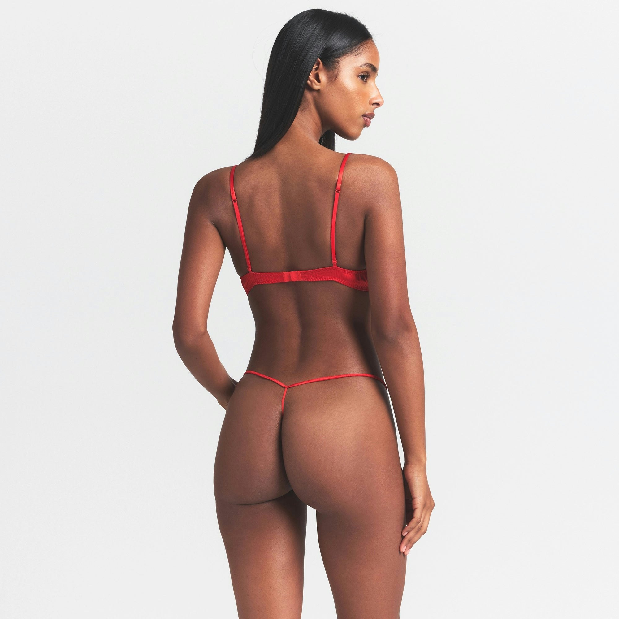 SILK LACE STRING THONG | RUBY CONTRAST ON A MODEL SIDE VIEW @ | FOCUS: 0.0, 1.0, 0.9