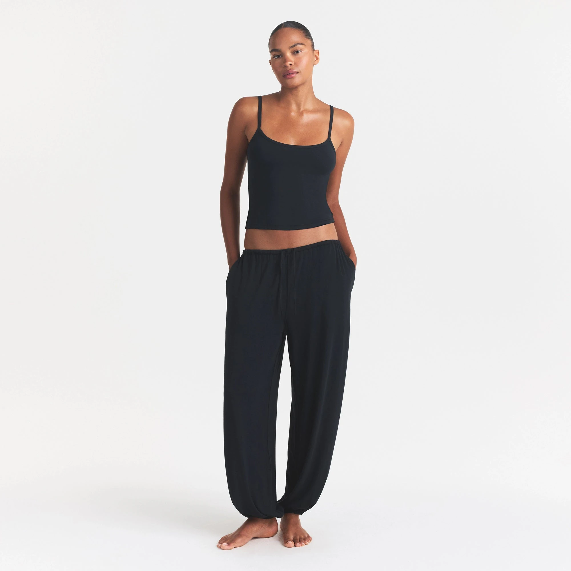 SKIMS SLEEP CAMI | ONYX ON A MODEL FRONT VIEW @ | FOCUS: 0.0, 1.0, 0.9