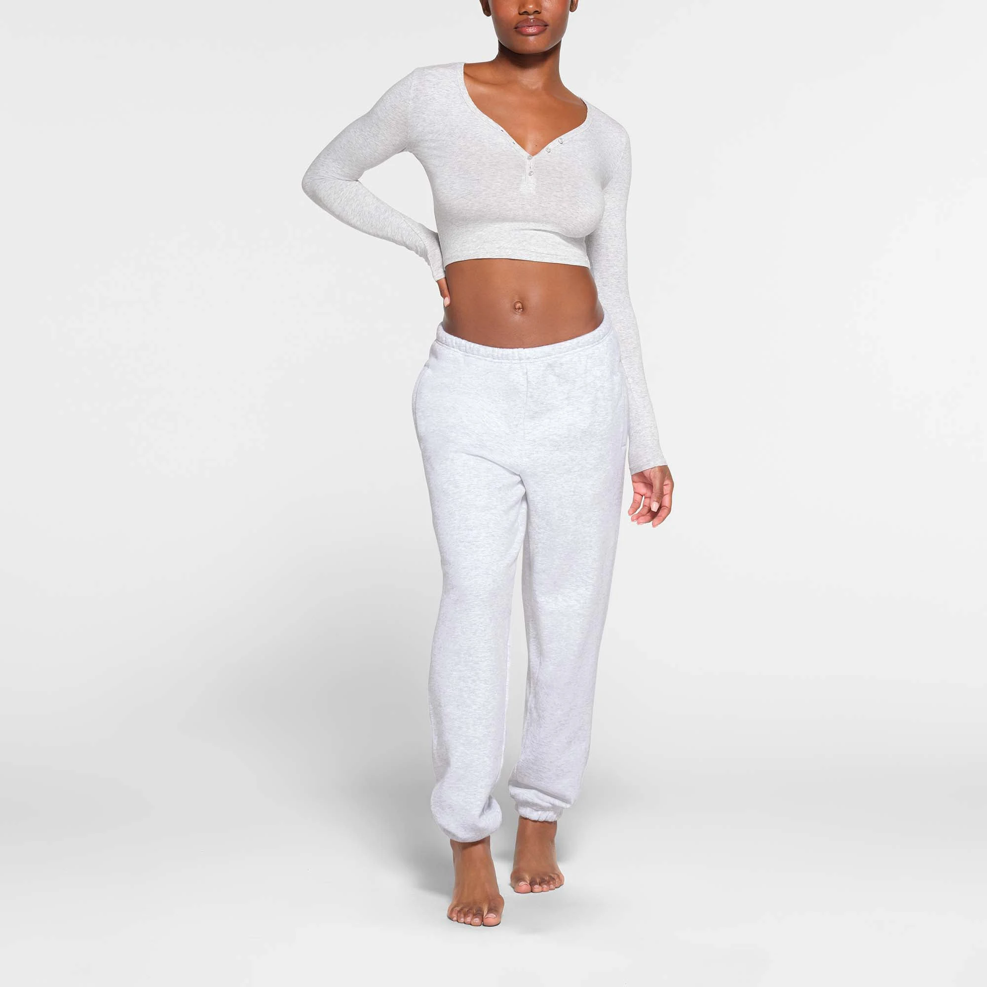 NEW VINTAGE LONG SLEEVE CROPPED HENLEY | LIGHT HEATHER GREY ON A MODEL FRONT VIEW