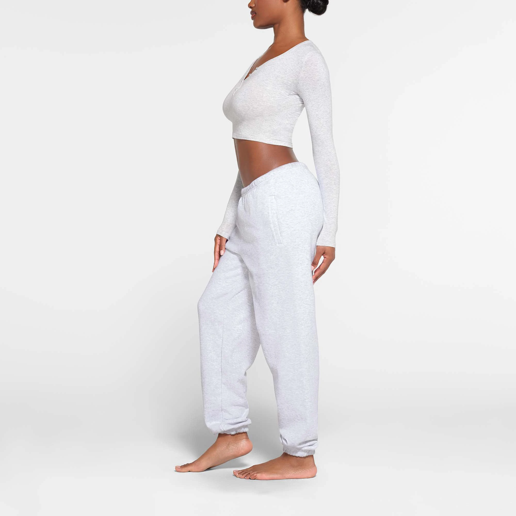 NEW VINTAGE LONG SLEEVE CROPPED HENLEY | LIGHT HEATHER GREY ON A MODEL SIDE VIEW