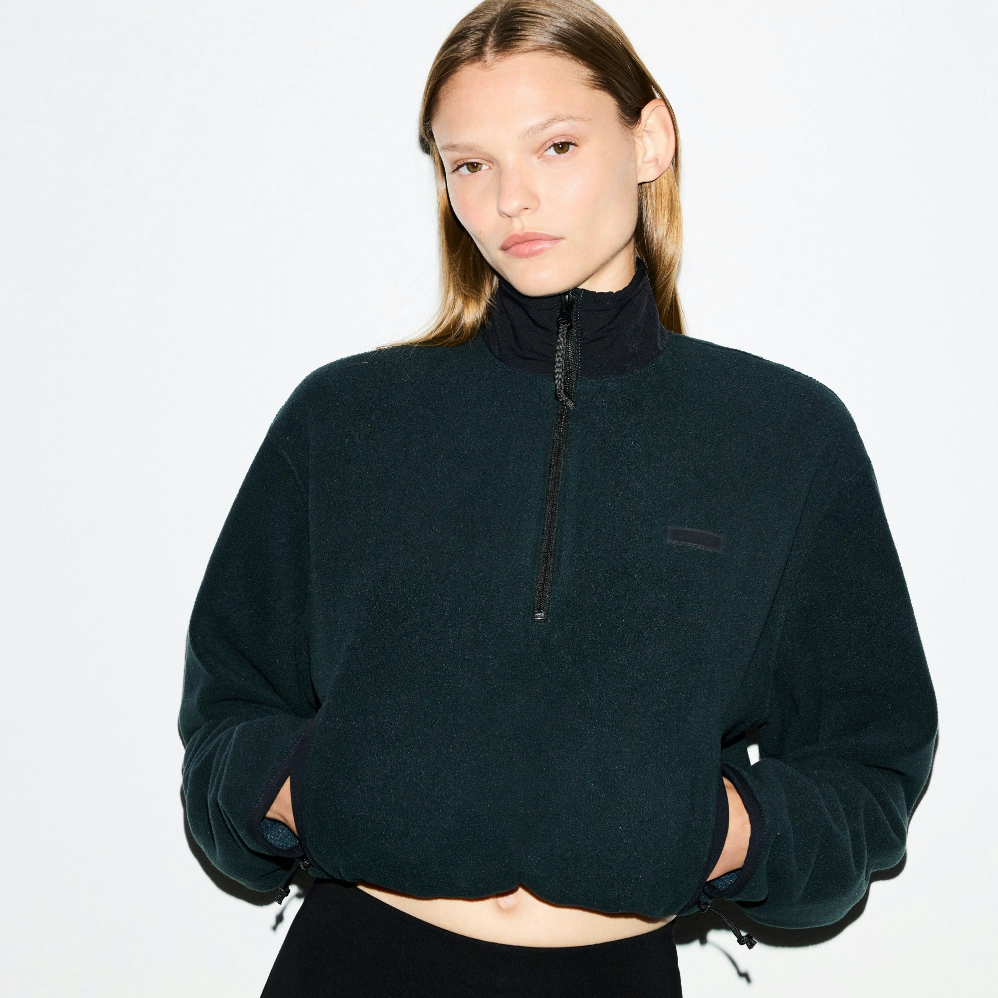 OUTDOOR FLEECE HALF ZIP PULLOVER | DARK TEAL ON A MODEL SIDE VIEW @ | FOCUS: 0.0, 1.0, 0.9