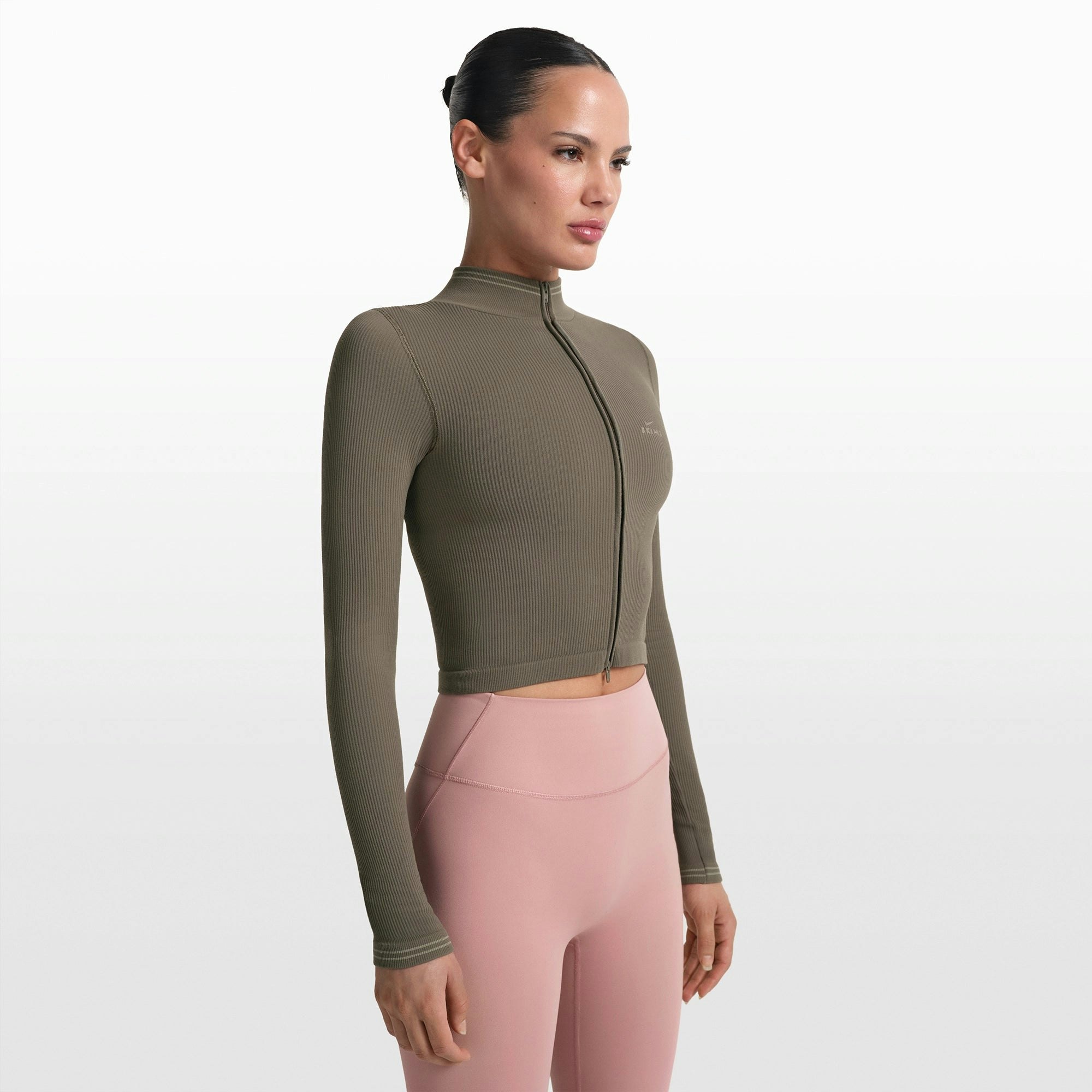 NikeSKIMS RIBBED SEAMLESS ZIP UP CROP JACKET | DUSTY OAKMOSS ON A MODEL FRONT VIEW @ | FOCUS: 0.0, 1.0, 0.9