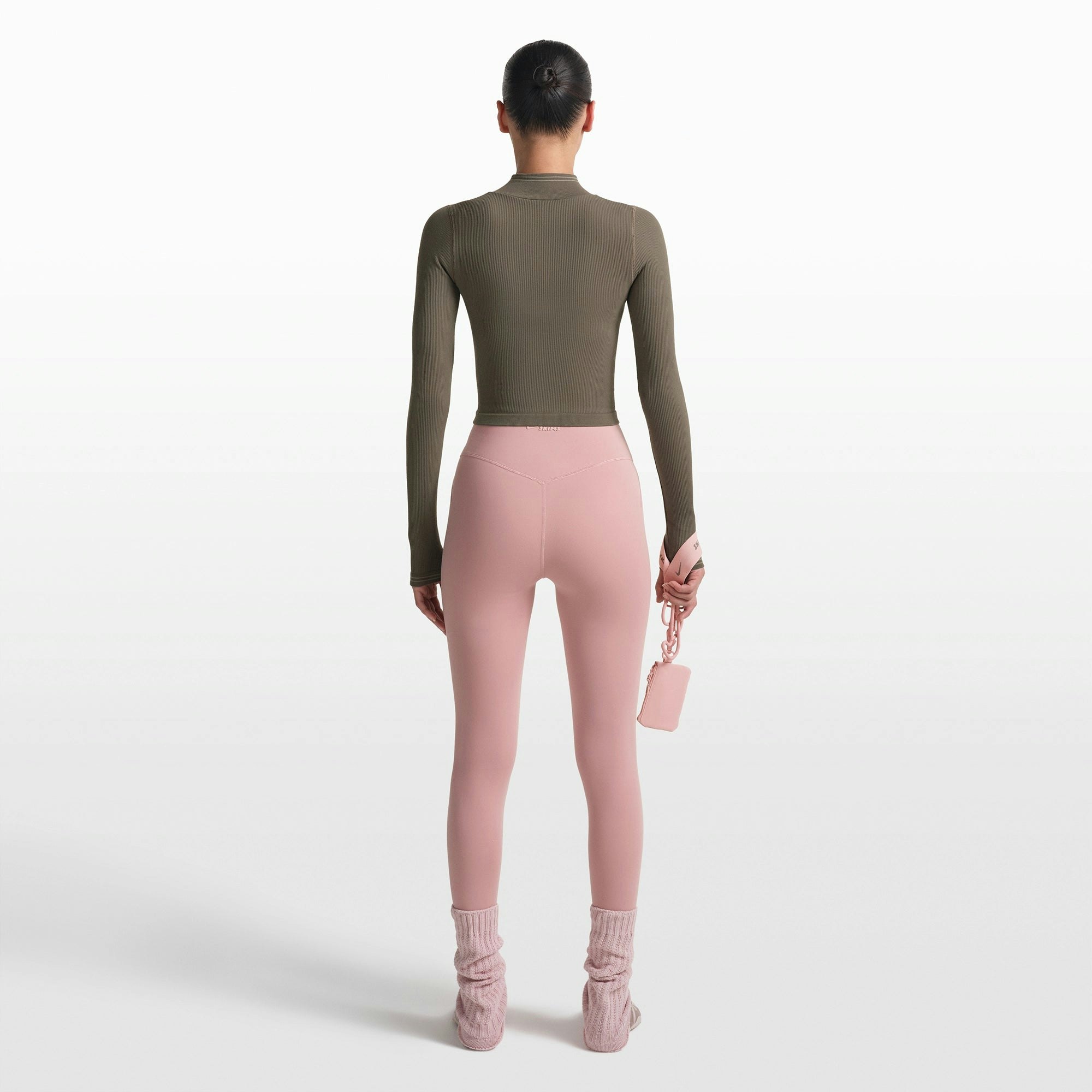 NikeSKIMS RIBBED SEAMLESS ZIP UP CROP JACKET | DUSTY OAKMOSS ON A MODEL FRONT VIEW @ | FOCUS: 0.0, 1.0, 0.9