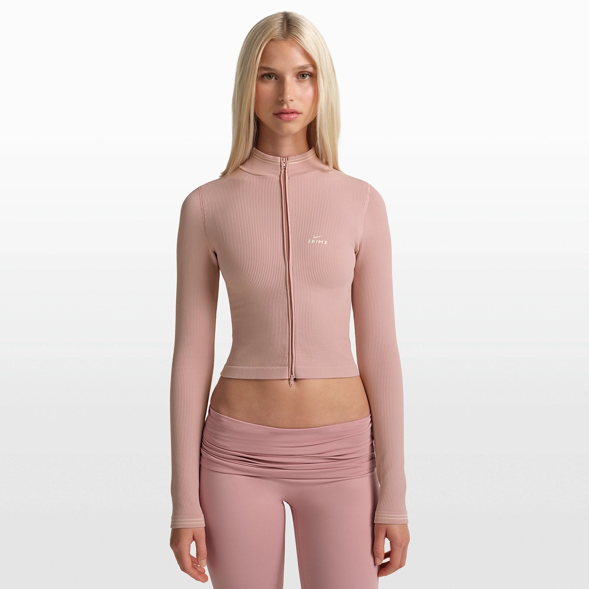 NikeSKIMS RIBBED SEAMLESS ZIP UP CROP JACKET | HIMALAYAN/ECRU ON A MODEL FRONT VIEW @ | FOCUS: 0.0, 1.0, 0.9