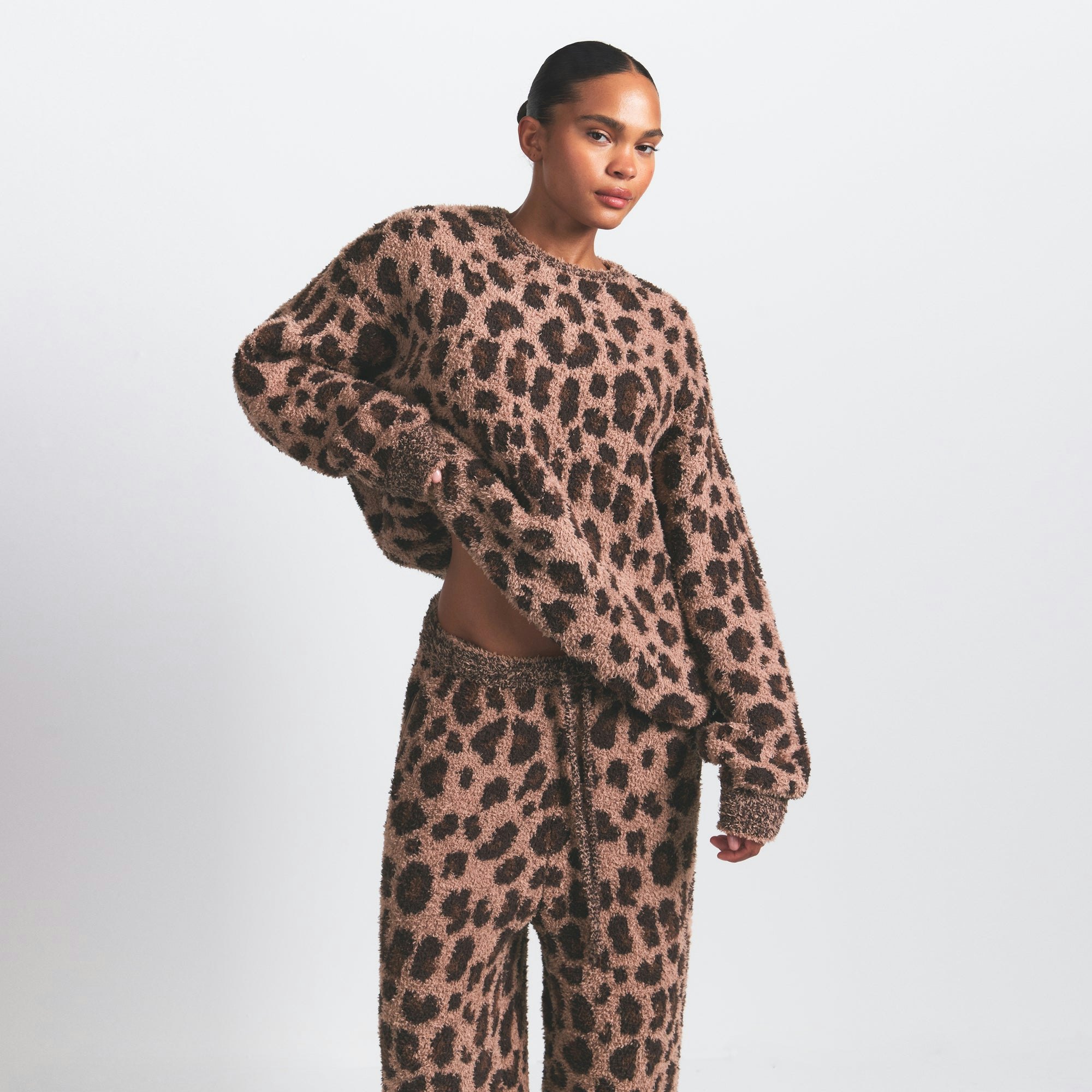 COZY OVERSIZED CREWNECK PULLOVER | SIENNA LEOPARD PRINT ON A MODEL SIDE VIEW @ | FOCUS: 0.0, 1.0, 0.9