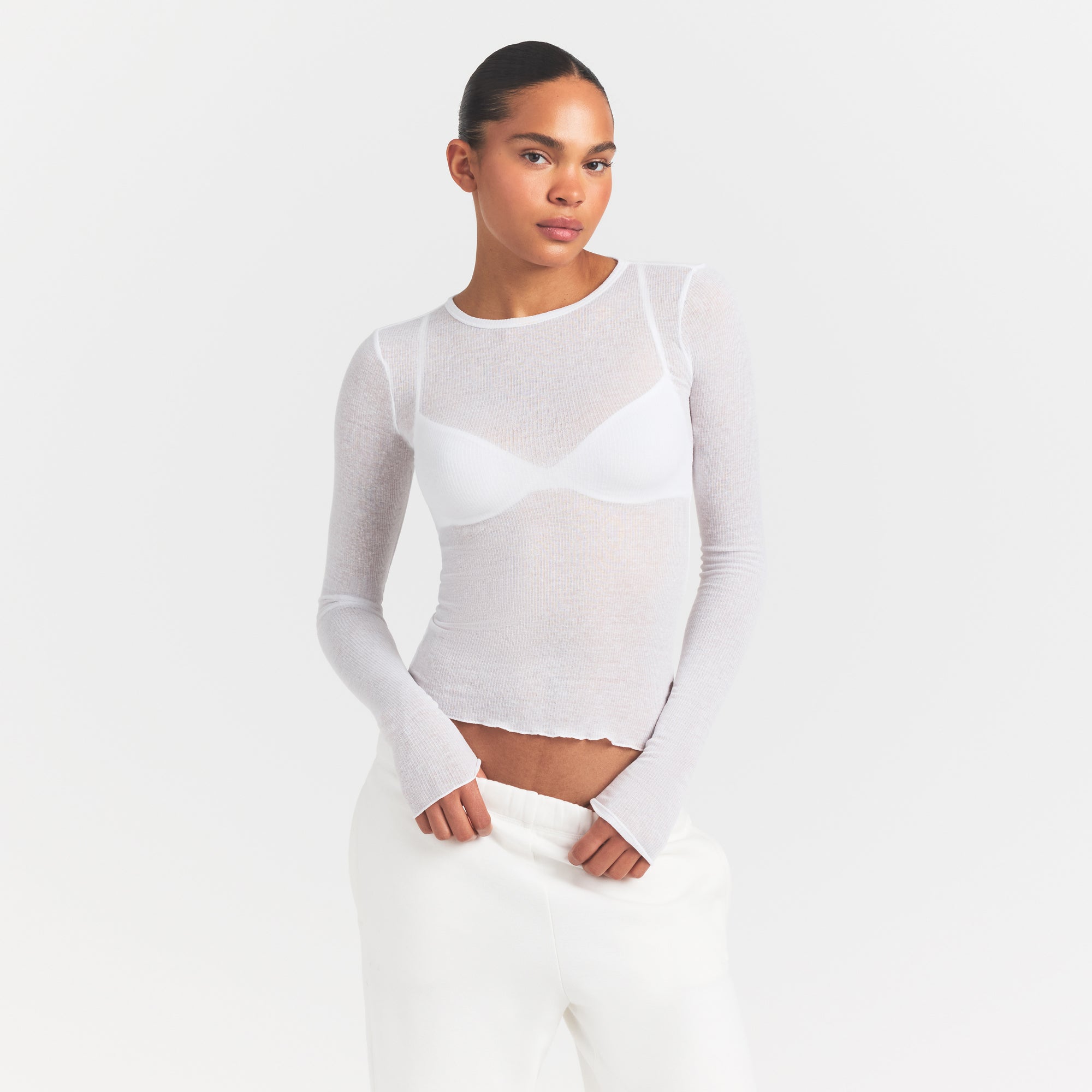 SHEER RIB LONG SLEEVE | SNOW ON A MODEL SIDE VIEW @ | FOCUS: 0.0, 1.0, 0.9