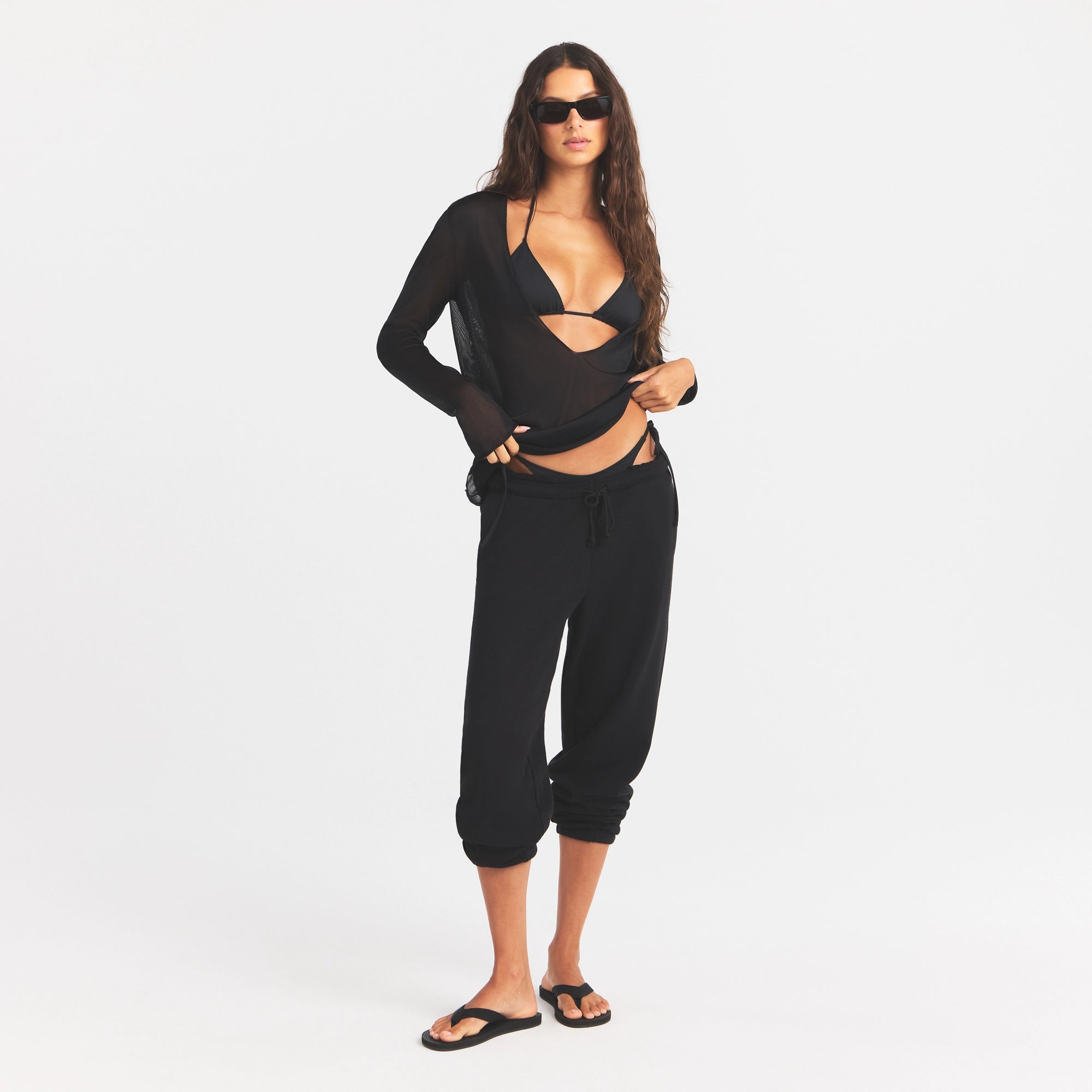 SLINKY KNIT DEEP PLUNGE TOP | OBSIDIAN ON A MODEL FRONT VIEW @ | FOCUS: 0.0, 1.0, 0.9