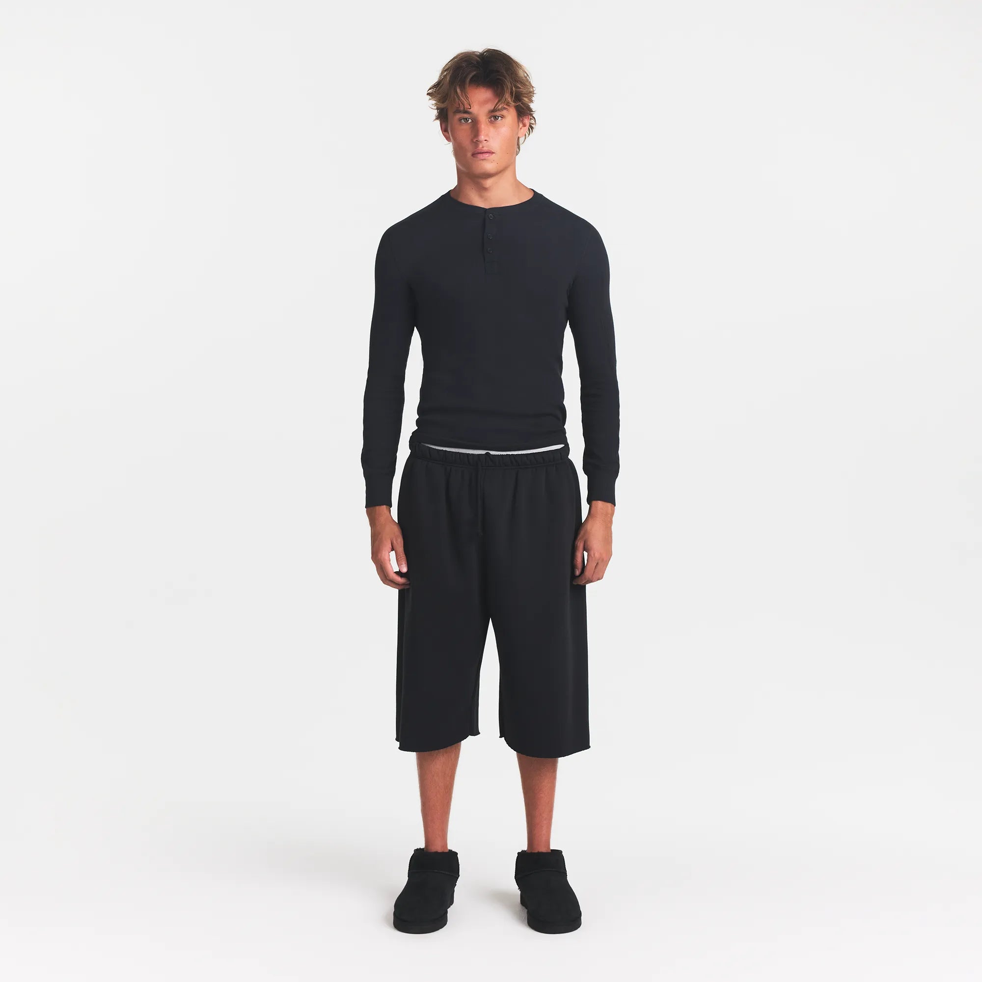 SKIMS COTTON RIB MENS HENLEY | ONYX ON A MODEL FRONT VIEW @ | FOCUS: 0.0, 1.0, 0.9