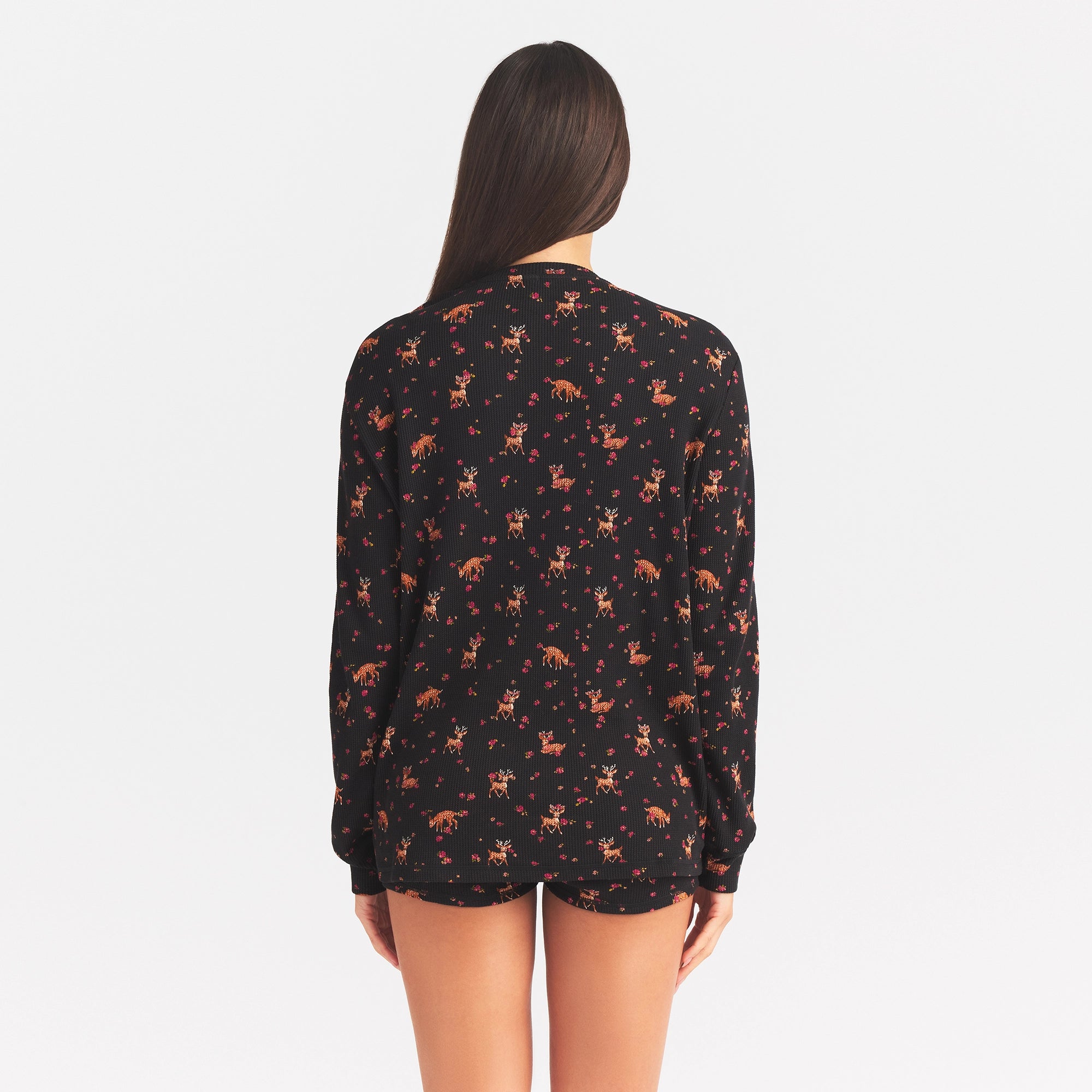 WAFFLE OVERSIZED LONG SLEEVE TOP | ONYX FLORAL DEER PRINT ON A MODEL BACK VIEW @ | FOCUS: 0.0, 1.0, 0.9