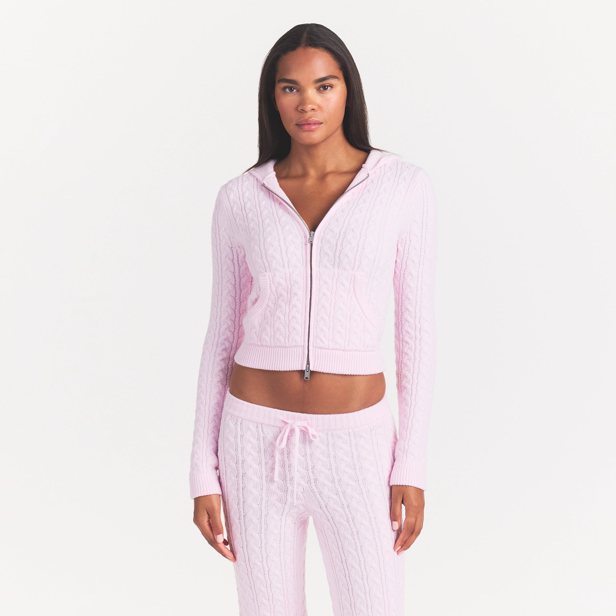 SWEATER KNIT CABLE ZIP UP HOODIE | CHERRY BLOSSOM ON A MODEL FRONT VIEW @ | FOCUS: 0.0, 1.0, 0.9