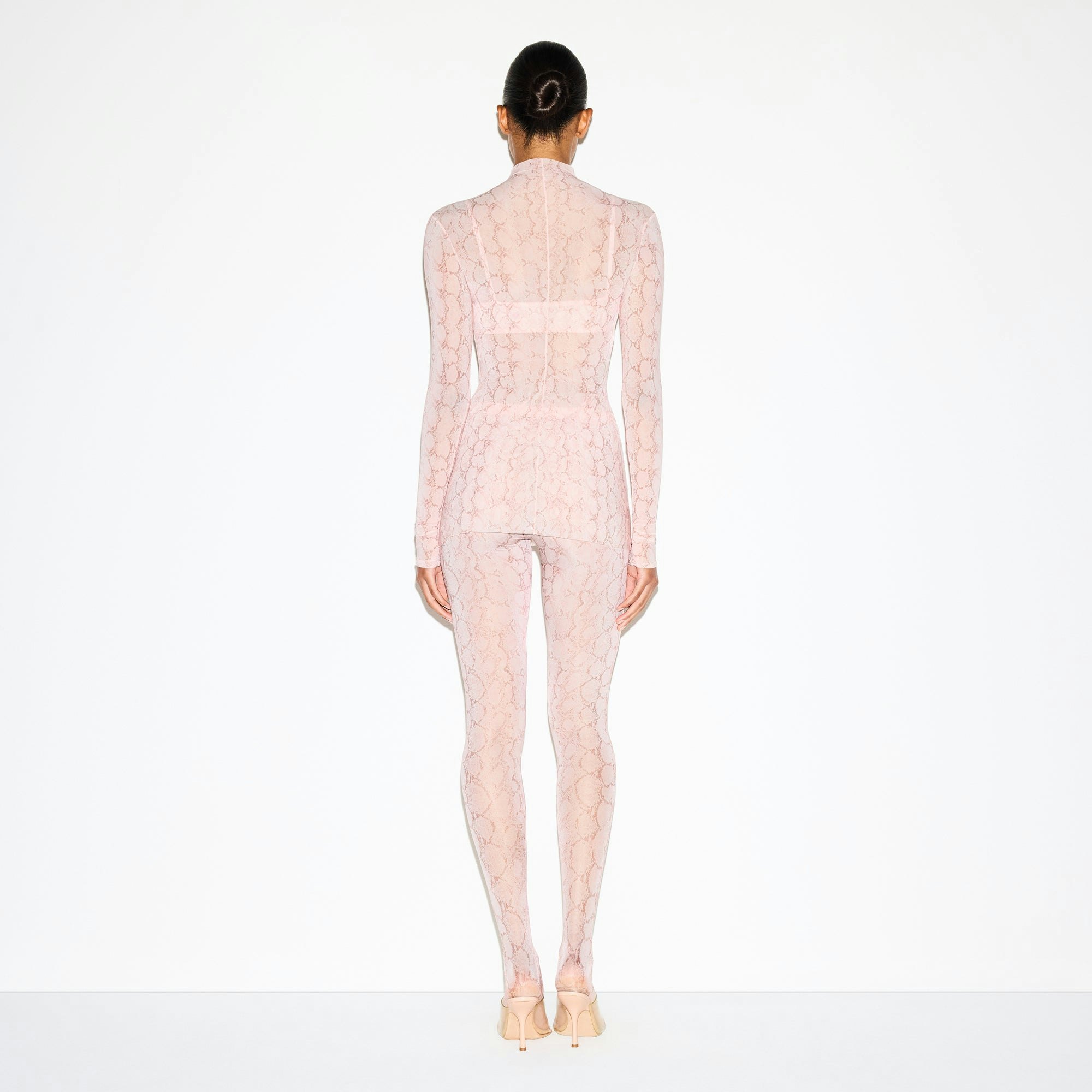MILKY SHEER TUNIC | ROSE PASTEL SNAKE PRINT ON A MODEL FRONT VIEW @ | FOCUS: 0.0, 1.0, 0.9