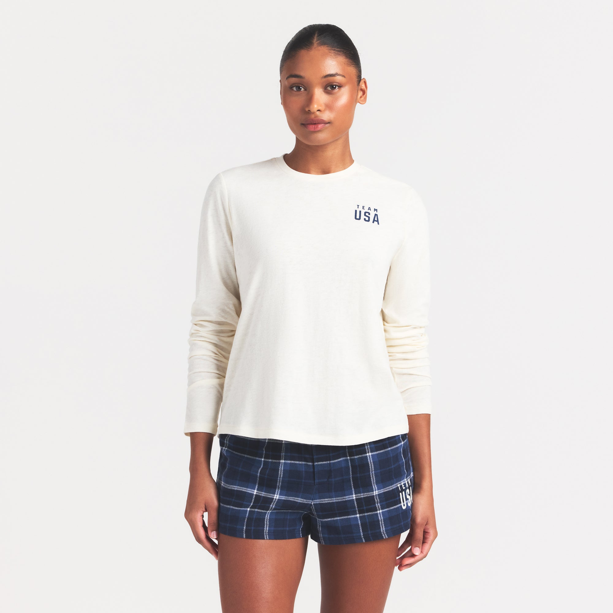 SKIMS FOR TEAM USA WORN IN JERSEY OLYMPIC LONG SLEEVE T-SHIRT | ECRU ON A MODEL SIDE VIEW @ | FOCUS: 0.0, 1.0, 0.9