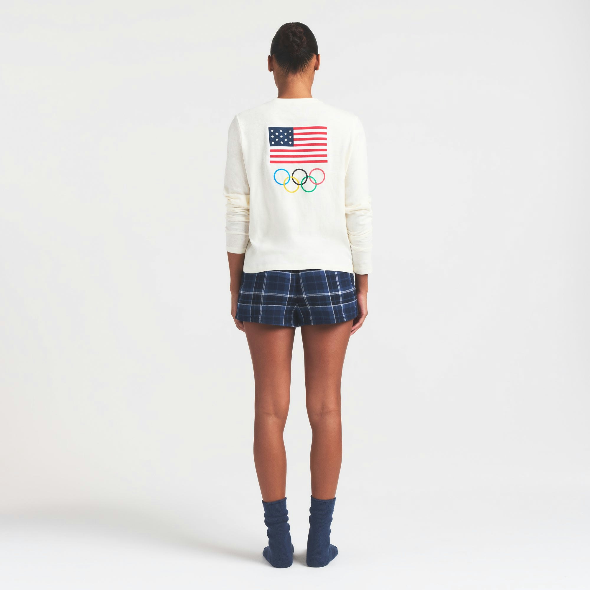 SKIMS FOR TEAM USA WORN IN JERSEY OLYMPIC LONG SLEEVE T-SHIRT | ECRU ON A MODEL FRONT VIEW @ | FOCUS: 0.0, 1.0, 0.9
