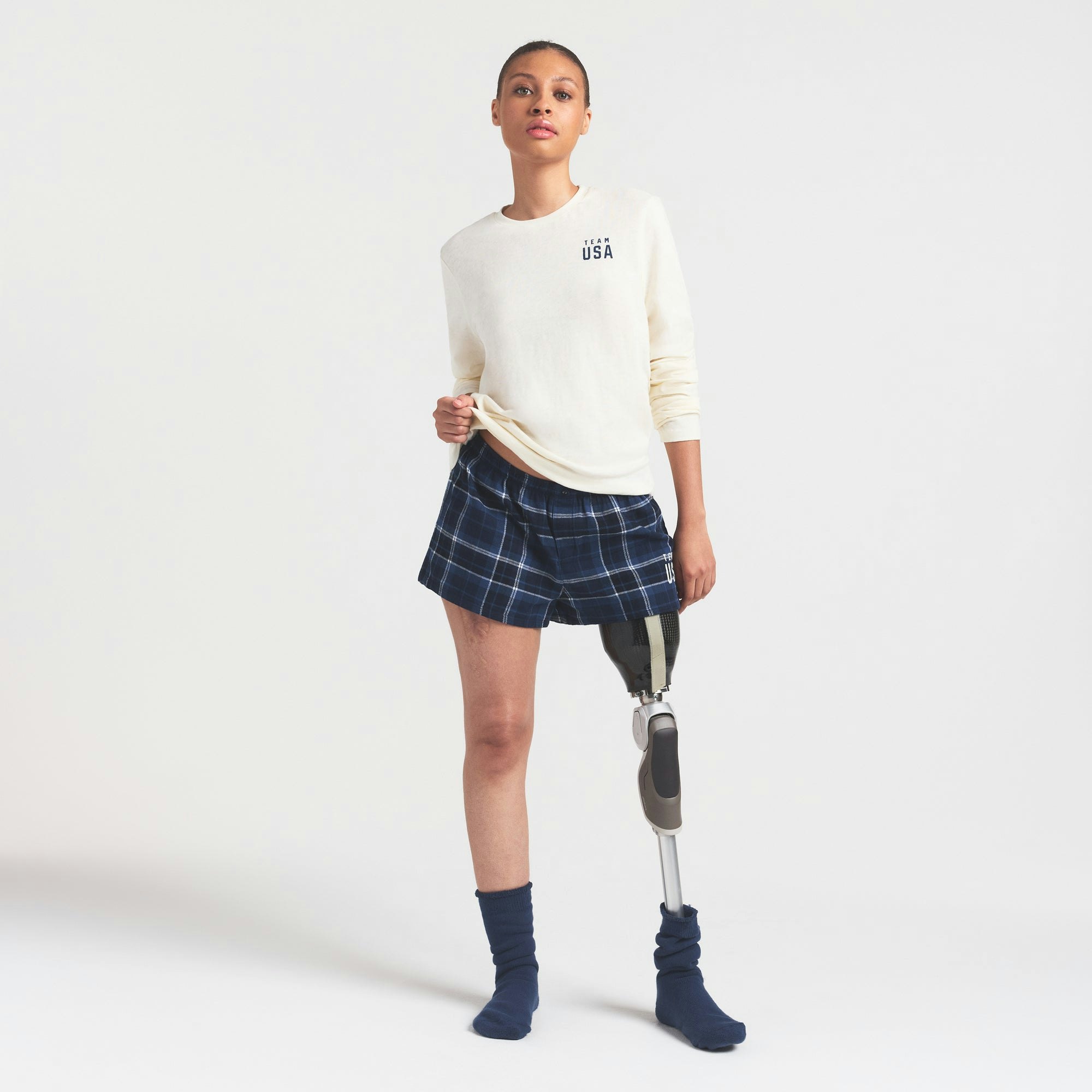 SKIMS FOR TEAM USA WORN IN JERSEY PARALYMPIC LONG SLEEVE T-SHIRT | ECRU ON A MODEL FRONT VIEW @ | FOCUS: 0.0, 1.0, 0.9