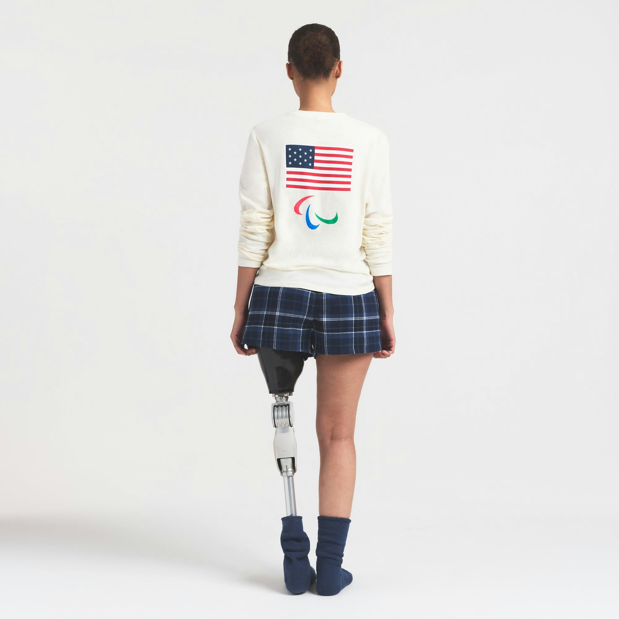 SKIMS FOR TEAM USA WORN IN JERSEY PARALYMPIC LONG SLEEVE T-SHIRT | ECRU ON A MODEL FRONT VIEW @ | FOCUS: 0.0, 1.0, 0.9