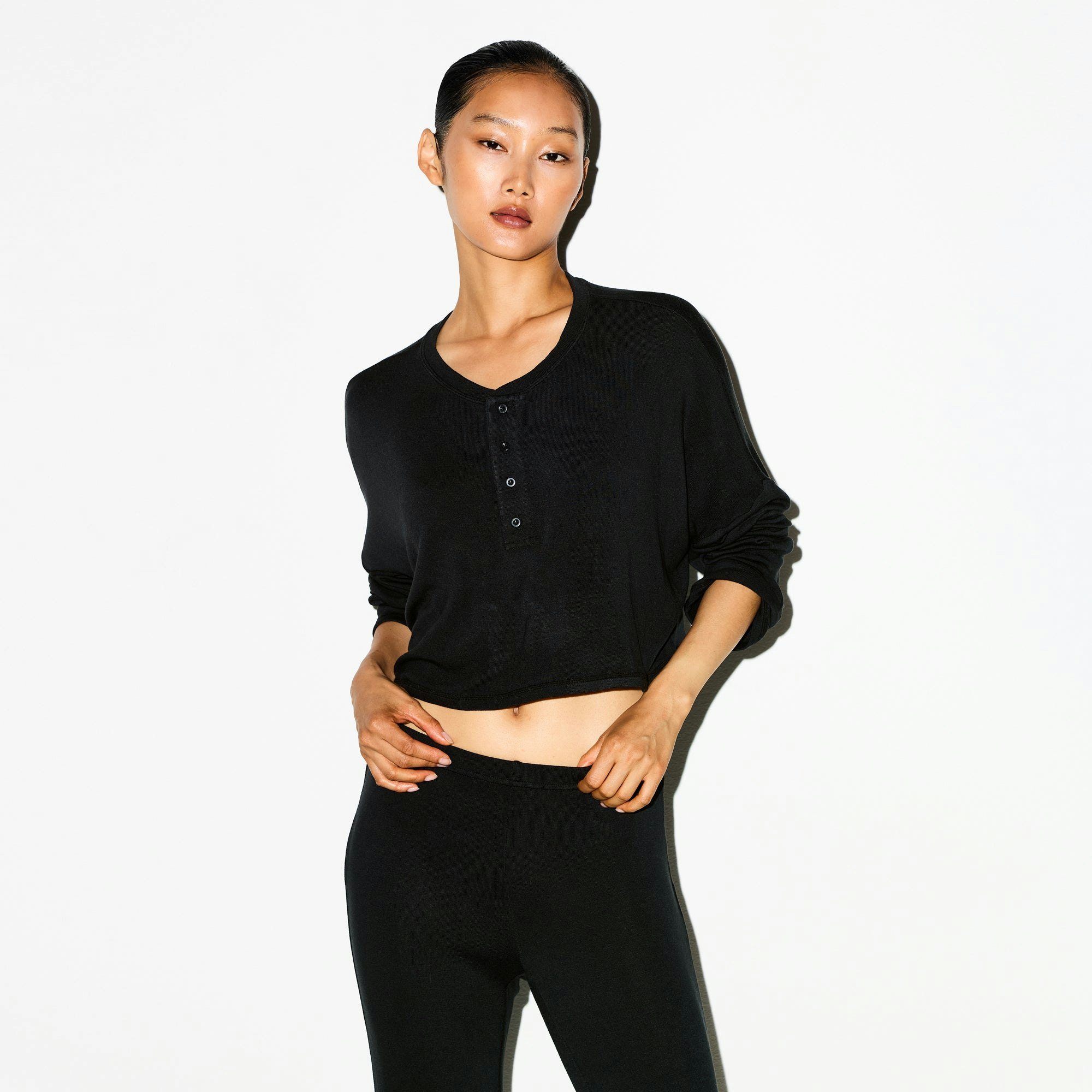 LIGHTWEIGHT MODAL CROPPED HENLEY | ONYX ON A MODEL SIDE VIEW @ | FOCUS: 0.0, 1.0, 0.9