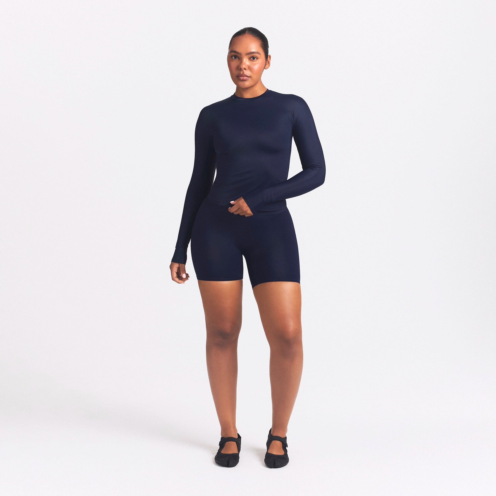 NikeSKIMS SHINE LONG SLEEVE CREW NECK TOP | NAVY ON A MODEL FRONT VIEW @ | FOCUS: 0.0, 1.0, 0.9