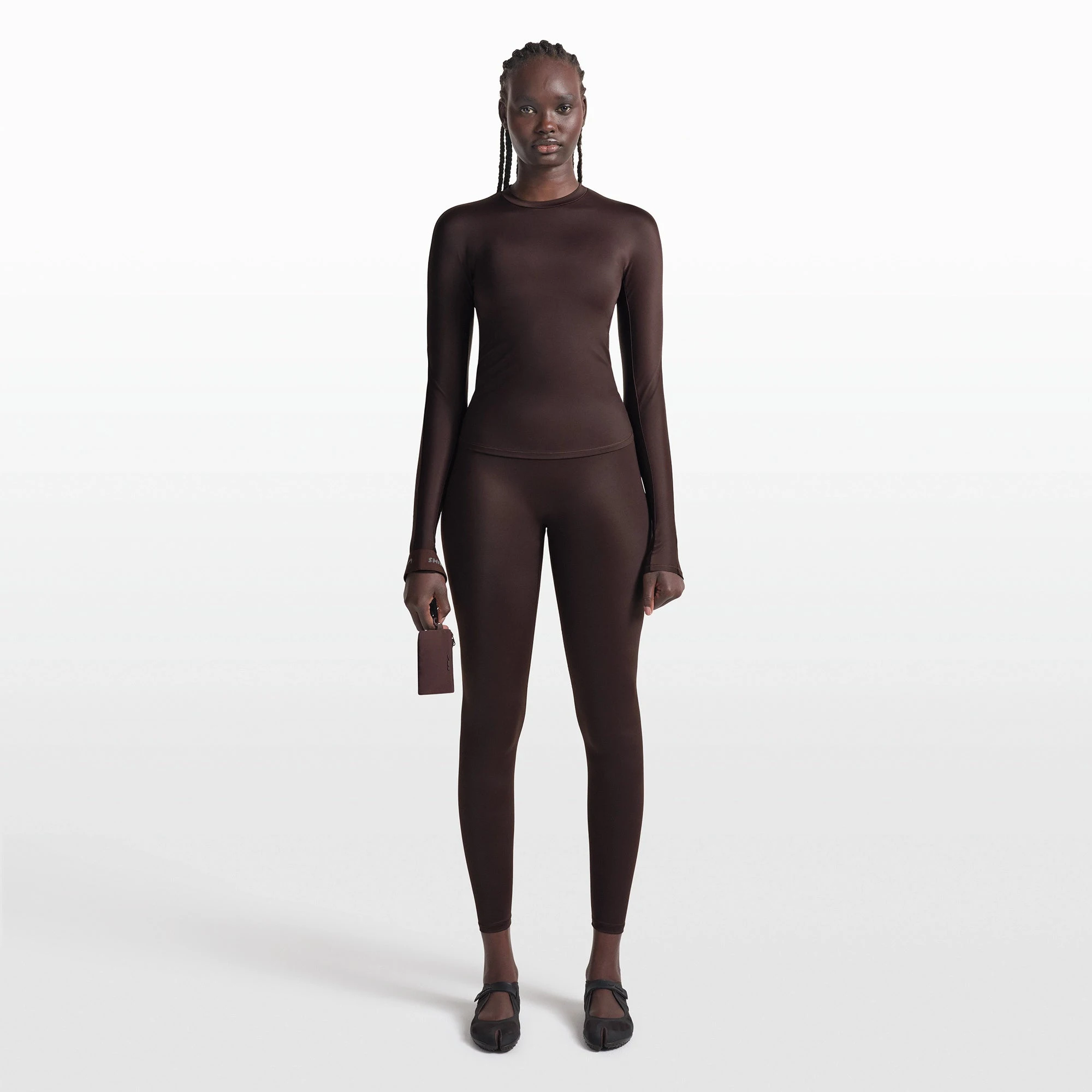 NikeSKIMS SHINE LONG SLEEVE CREW NECK TOP | PHOENIX ON A MODEL FRONT VIEW