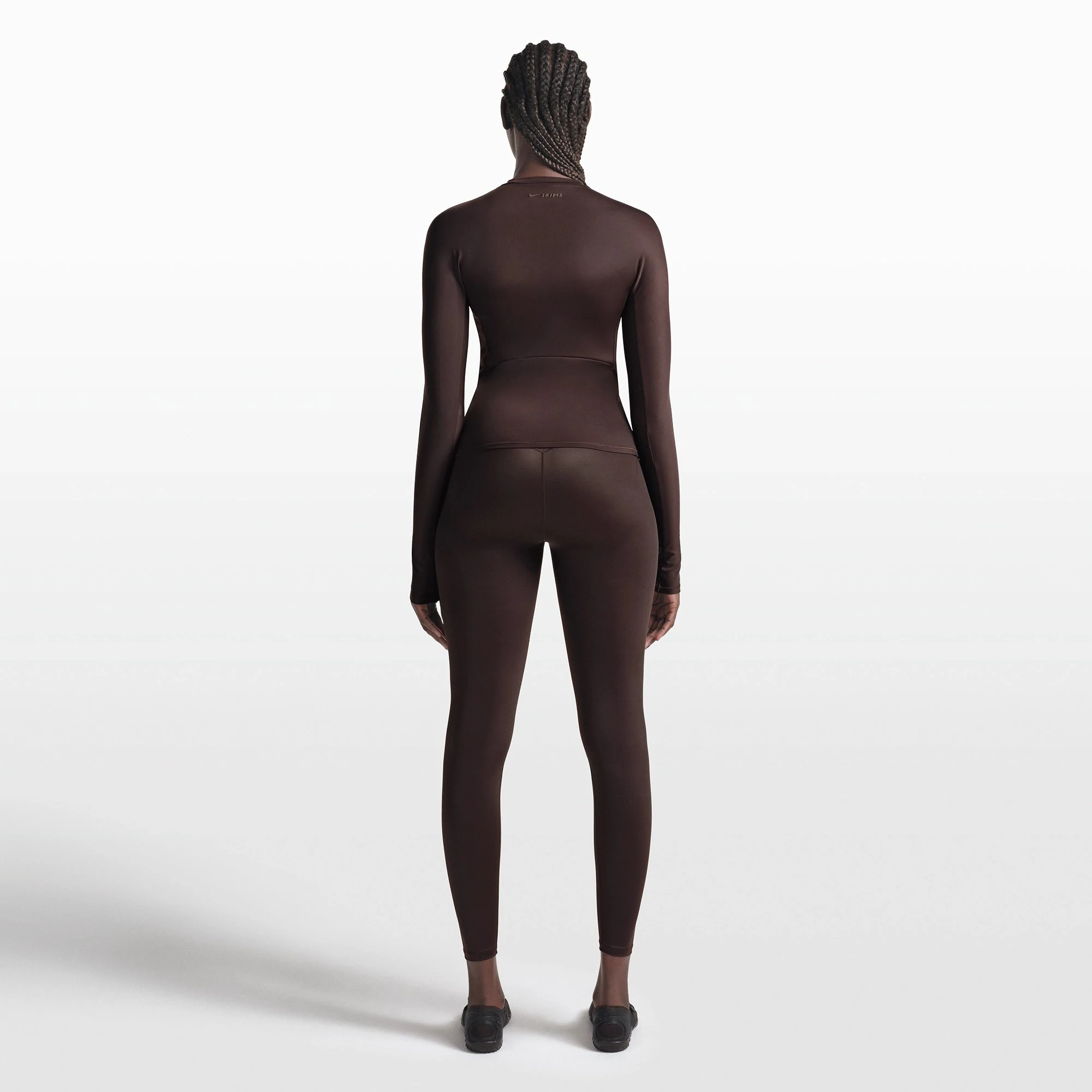 NikeSKIMS SHINE LONG SLEEVE CREW NECK TOP | PHOENIX ON A MODEL FRONT VIEW