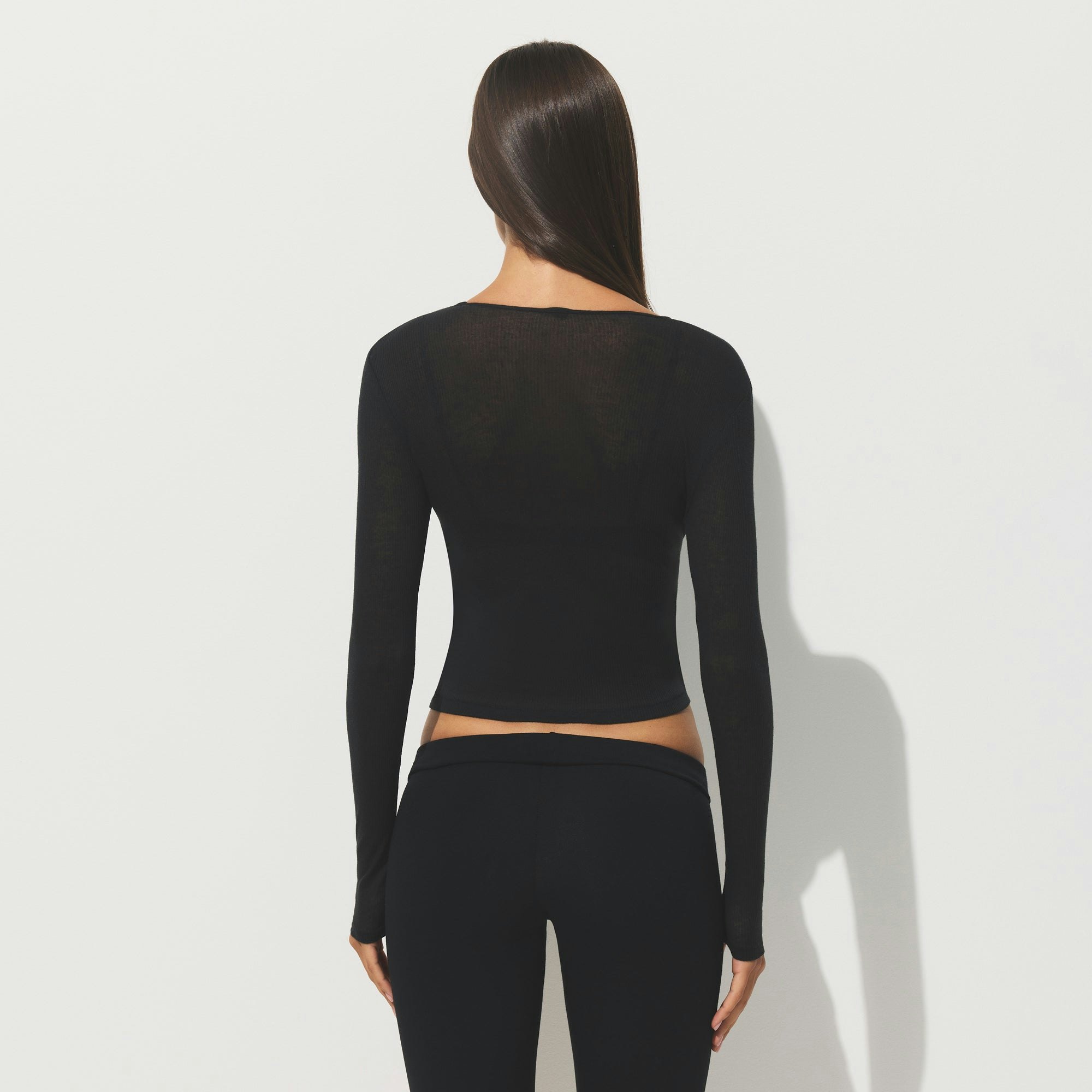SHEER COTTON LONG SLEEVE T-SHIRT | SOOT ON A MODEL SIDE VIEW | FOCUS: 0.0, 1.0, 0.9