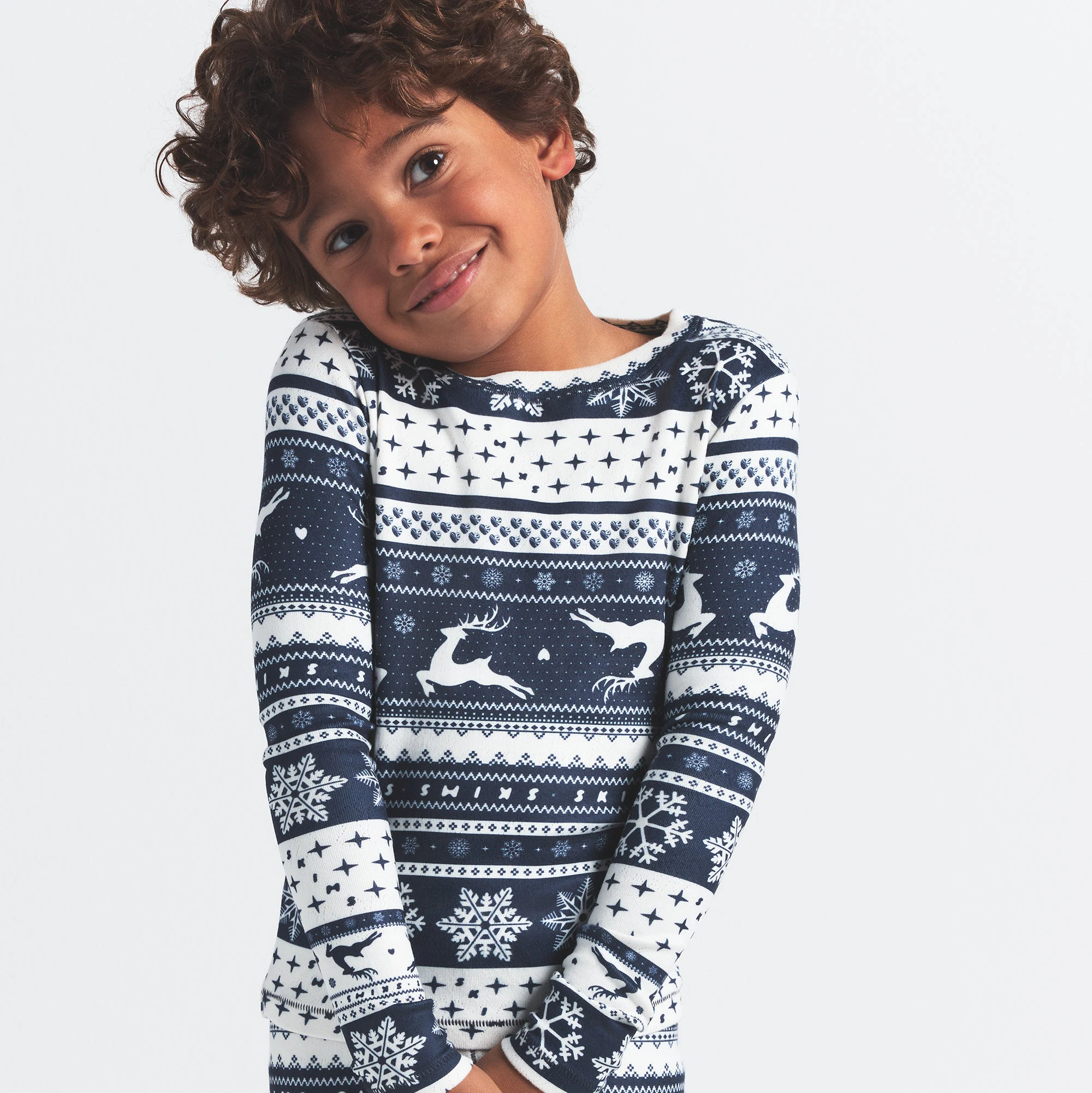 LOGO PLUSH POINTELLE KIDS LONG SLEEVE SET | NAVY DEER FAIR ISLE ON A MODEL FRONT VIEW