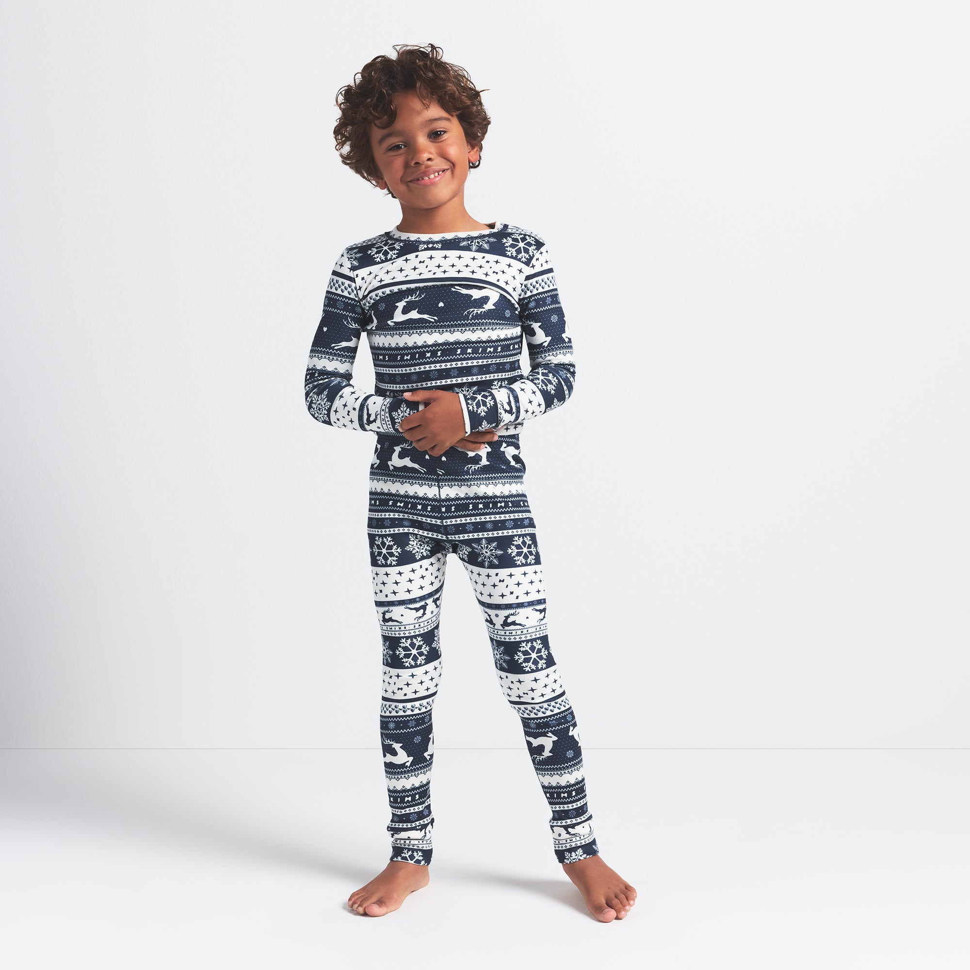 LOGO PLUSH POINTELLE KIDS LONG SLEEVE SET | NAVY DEER FAIR ISLE ON A MODEL FRONT VIEW
