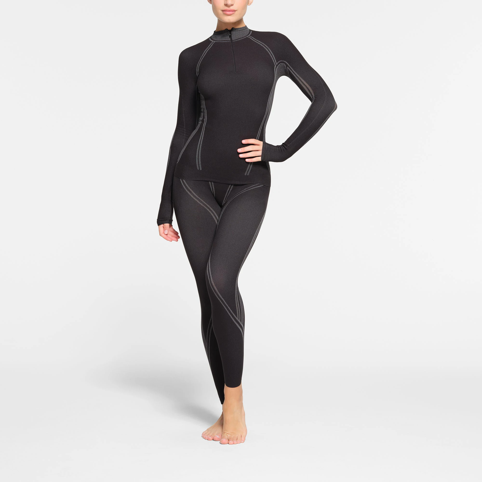 SKIMS FIRST LAYERS TURTLENECK TOP | ONYX ON A MODEL FRONT VIEW