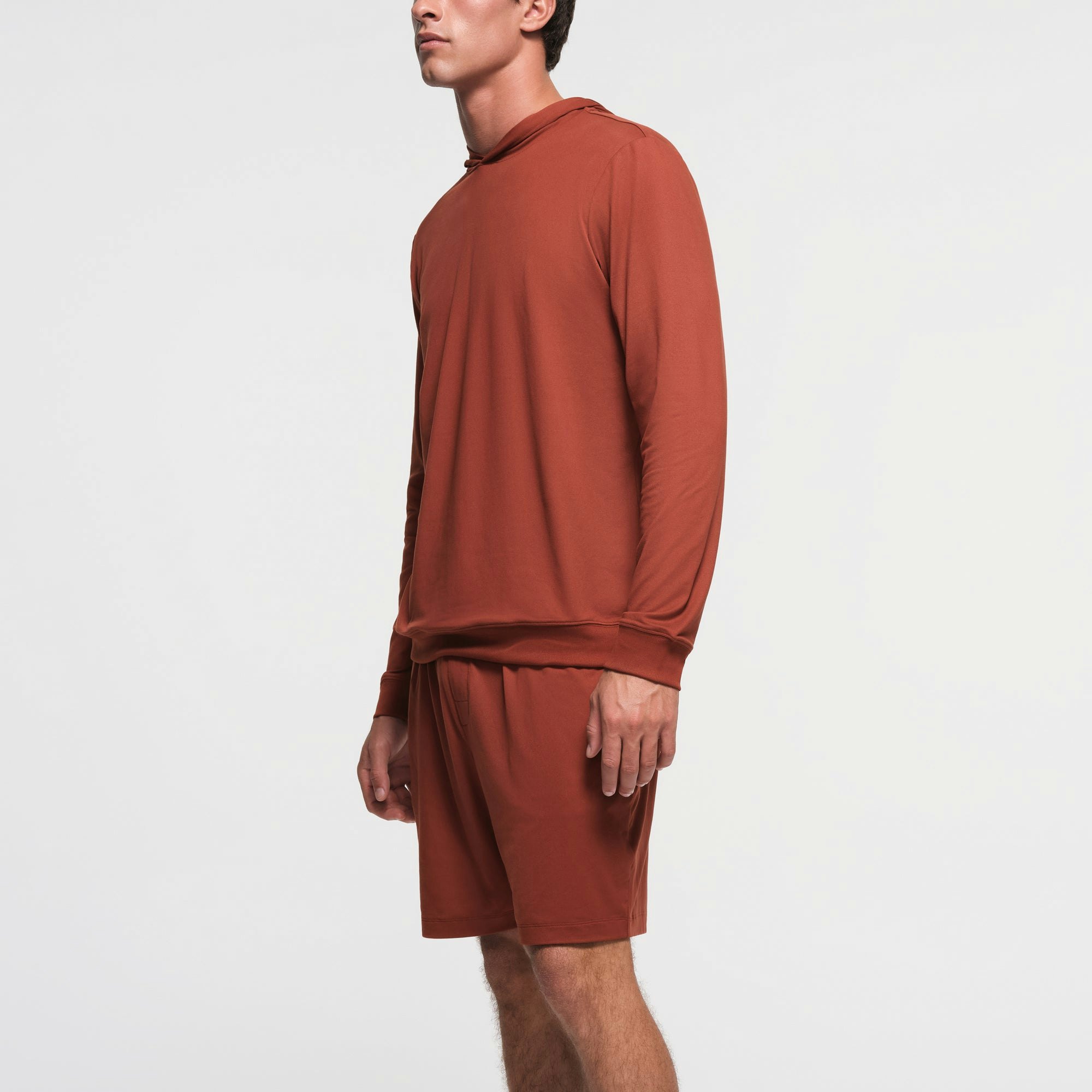 OUTDOOR JERSEY MENS CLASSIC HOODIE | RUST ON A MODEL SIDE VIEW