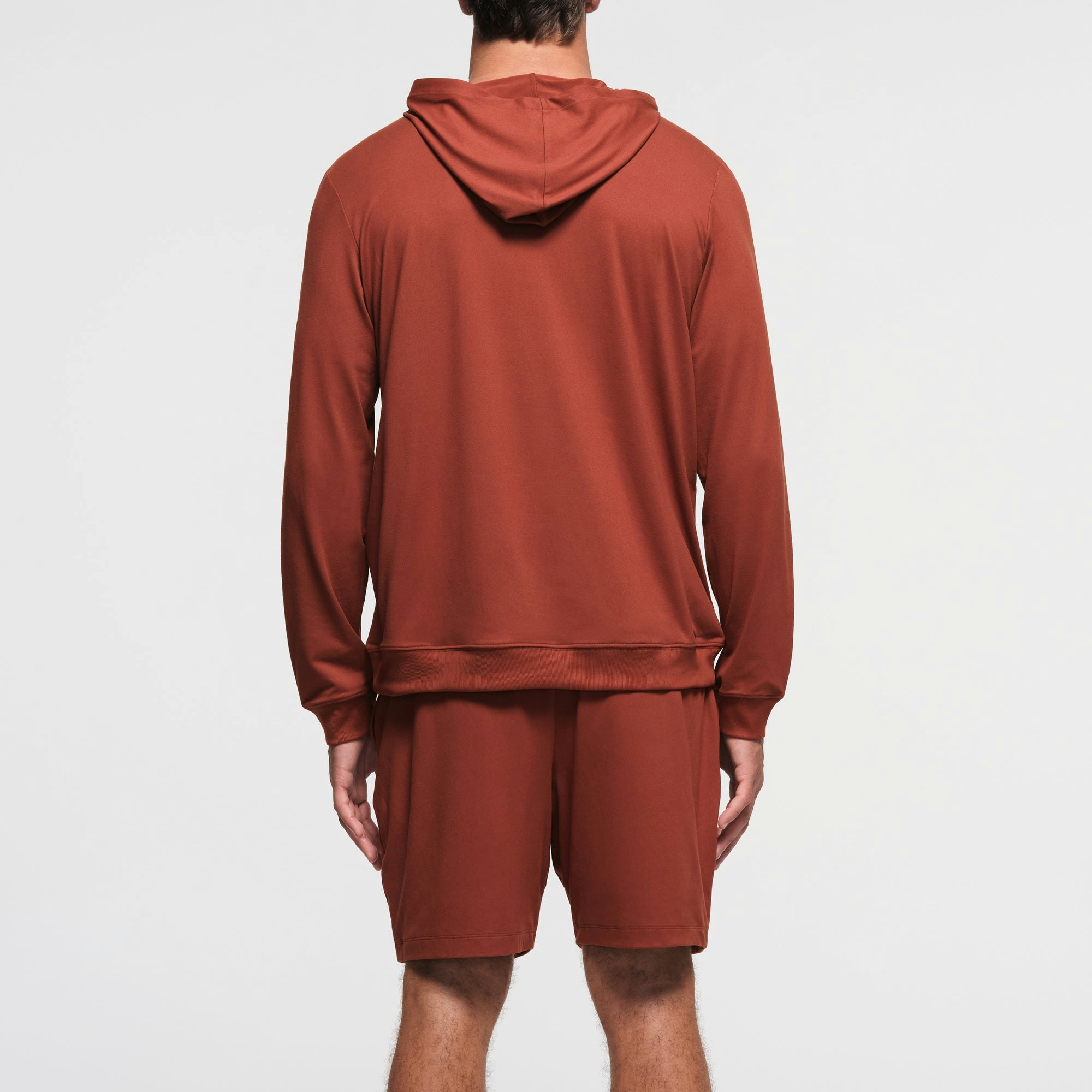 OUTDOOR JERSEY MENS CLASSIC HOODIE | RUST ON A MODEL BACK VIEW