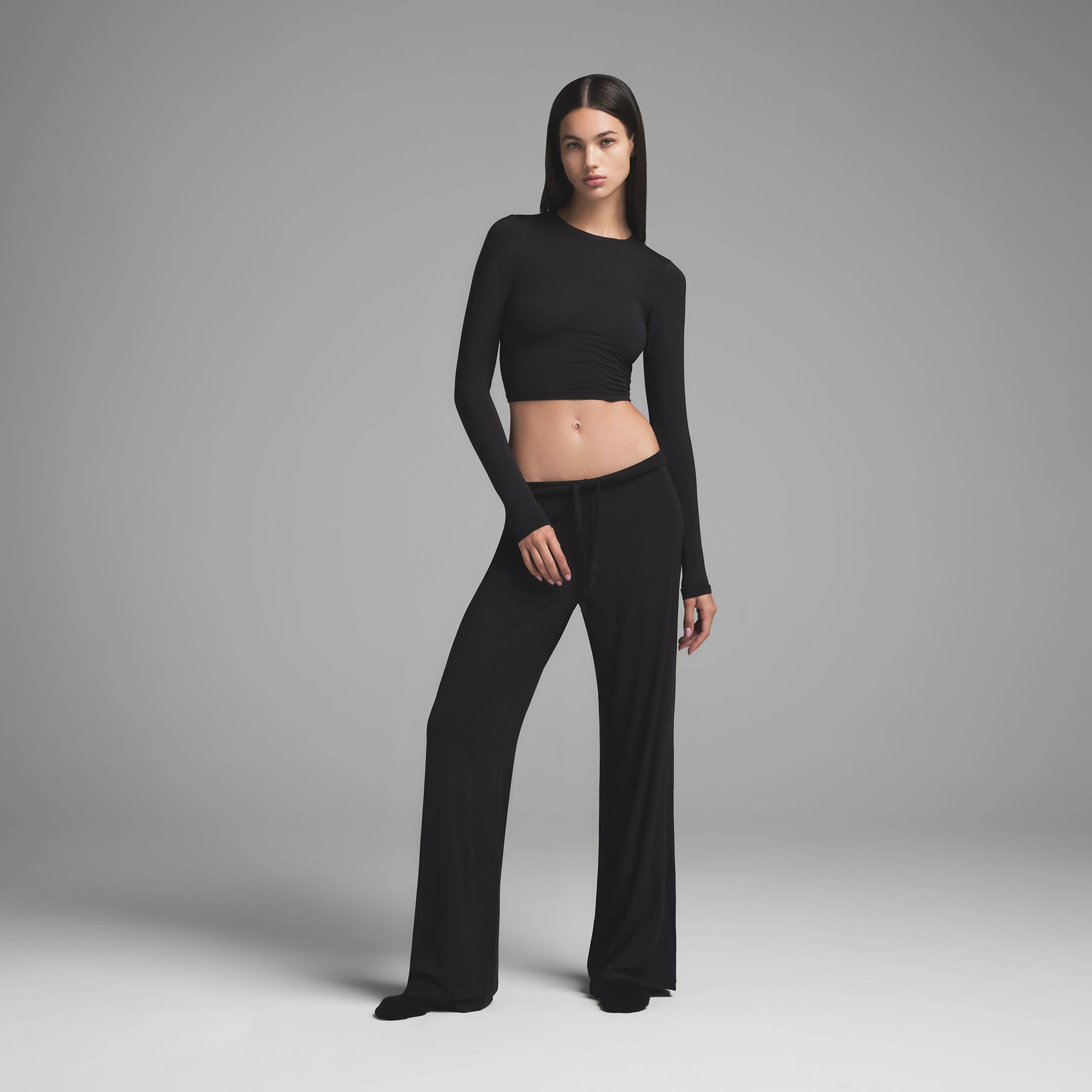 SKIMS SLEEP SUPER CROPPED LONG SLEEVE | ONYX ON A MODEL FRONT VIEW | FOCUS: 0.0, 1.0, 0.9