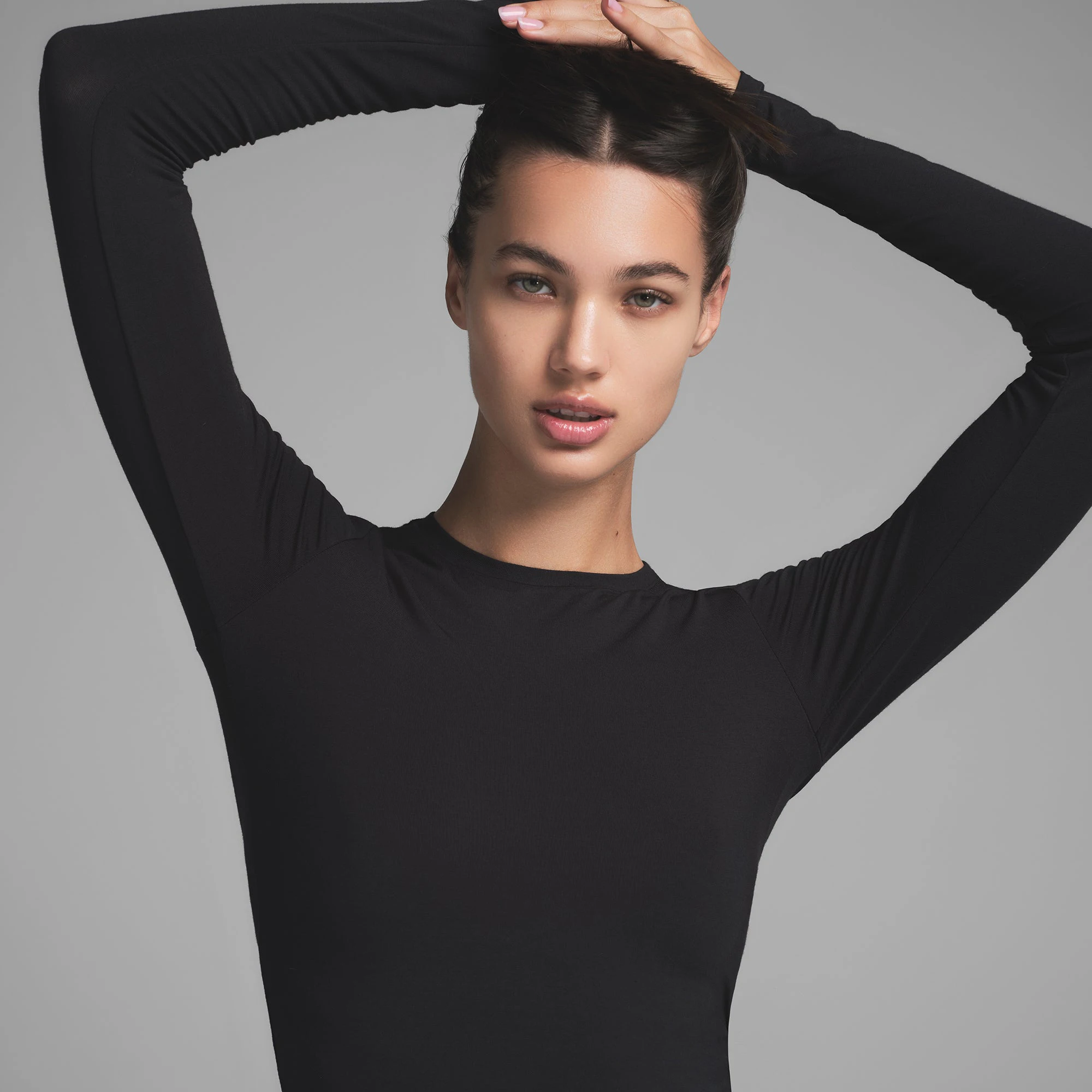 SKIMS SLEEP SUPER CROPPED LONG SLEEVE | ONYX ON A MODEL FRONT VIEW
