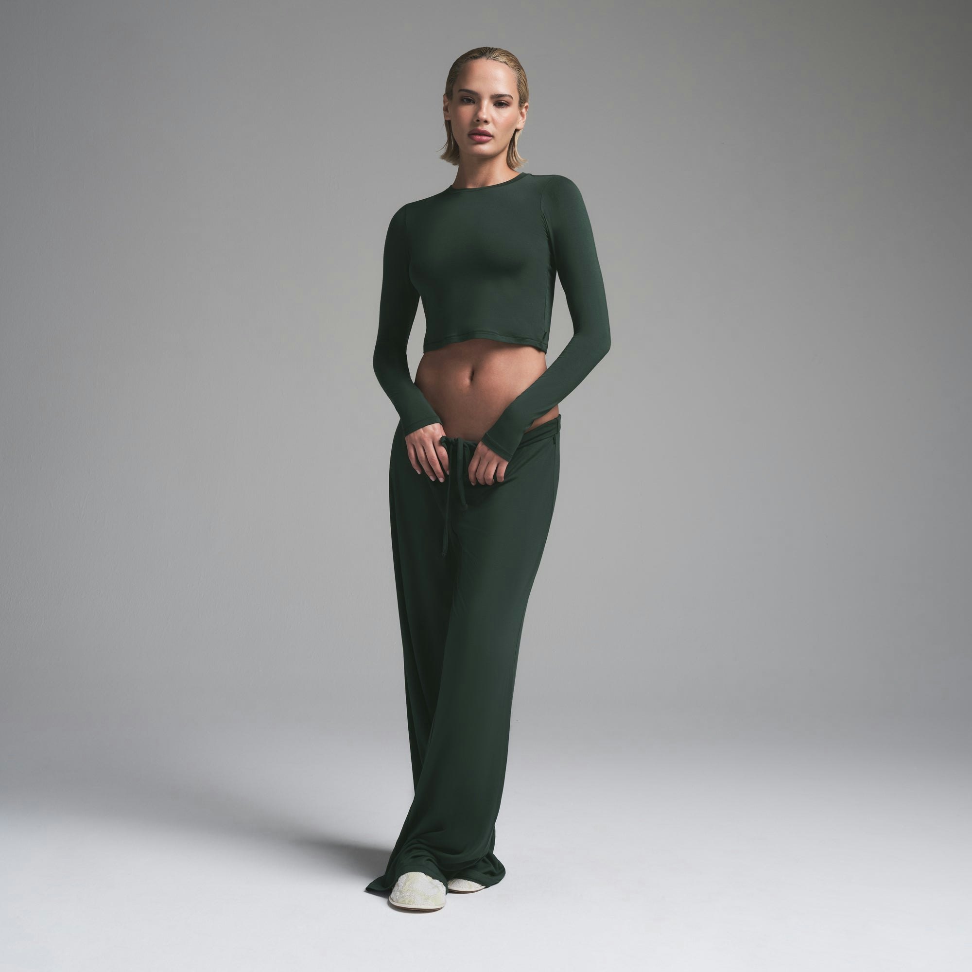 SKIMS SLEEP SUPER CROPPED LONG SLEEVE | SPRUCE ON A MODEL FRONT VIEW | FOCUS: 0.0, 1.0, 0.9