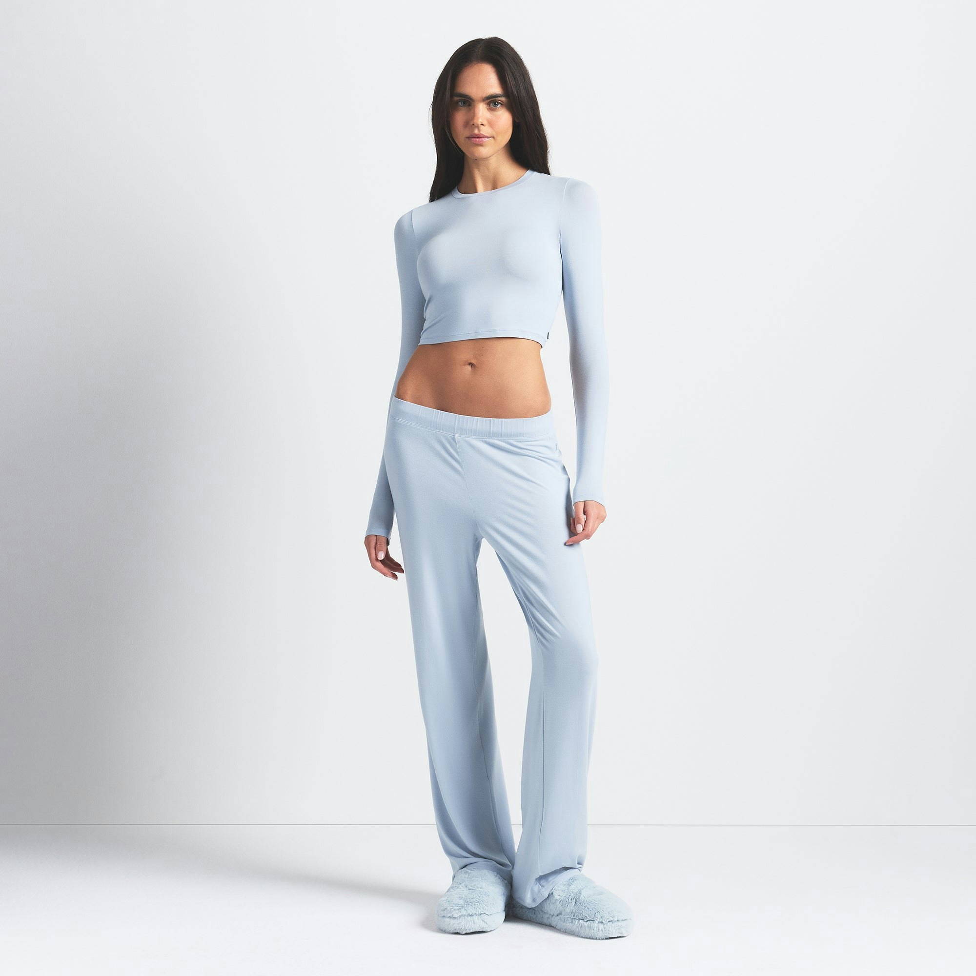 SKIMS SLEEP SUPER CROPPED LONG SLEEVE | ZEN BLUE ON A MODEL FRONT VIEW @ | FOCUS: 0.0, 1.0, 0.9
