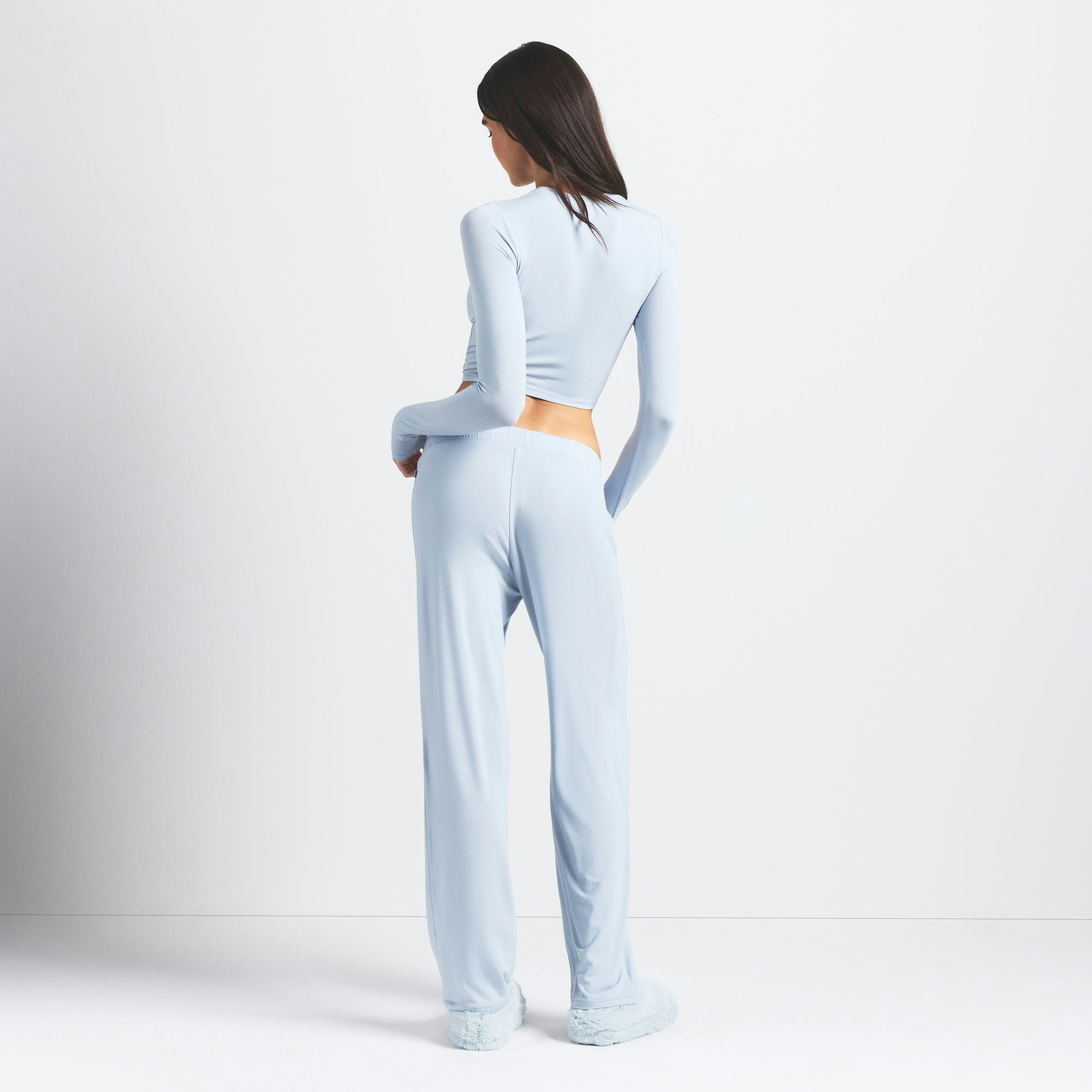 SKIMS SLEEP SUPER CROPPED LONG SLEEVE | ZEN BLUE ON A MODEL BACK VIEW @ | FOCUS: 0.0, 1.0, 0.9