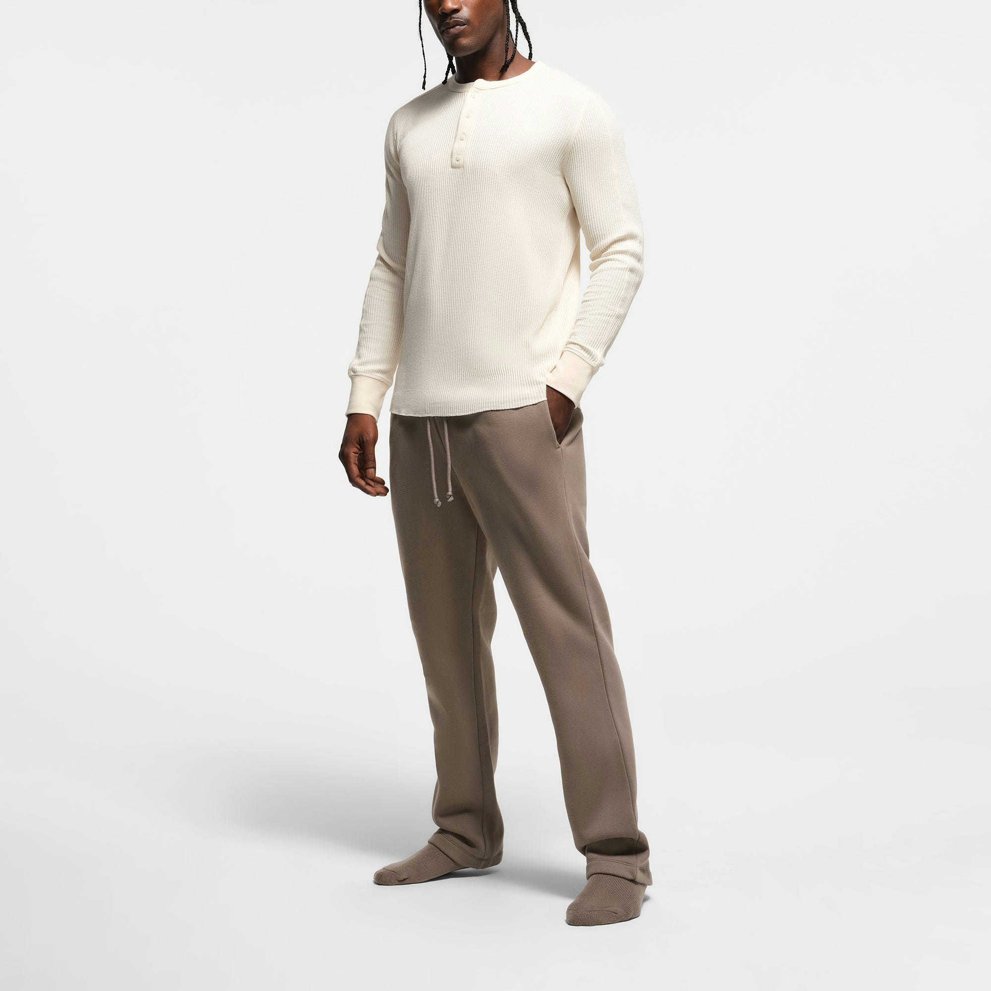 WAFFLE MENS SLIM LONG SLEEVE HENLEY | ECRU ON A MODEL SIDE VIEW @ | FOCUS: 0.9, 0.1, 0.7