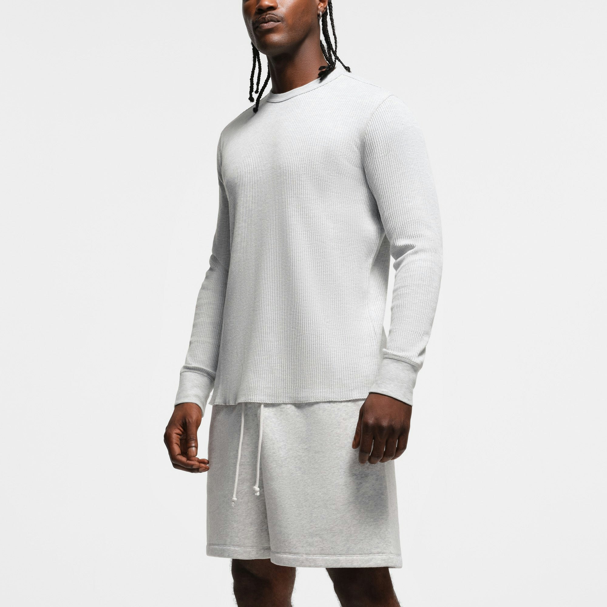 WAFFLE MENS LONG SLEEVE T-SHIRT | LIGHT HEATHER GREY ON A MODEL SIDE VIEW