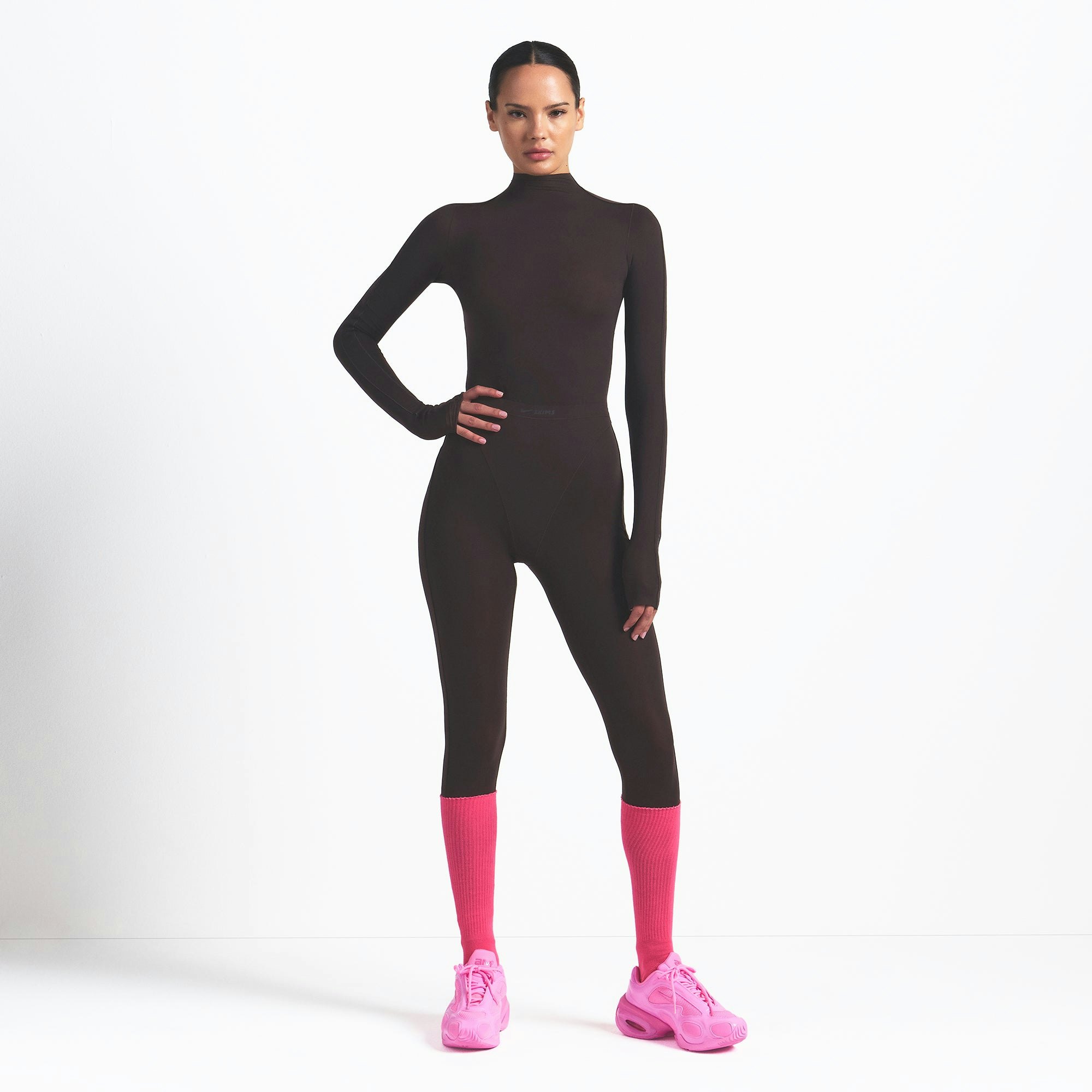 NikeSKIMS WEIGHTLESS LAYERS MOCK NECK LONG SLEEVE TOP | DARK ROAST ON A MODEL FRONT VIEW @ | FOCUS: 0.0, 1.0, 0.9