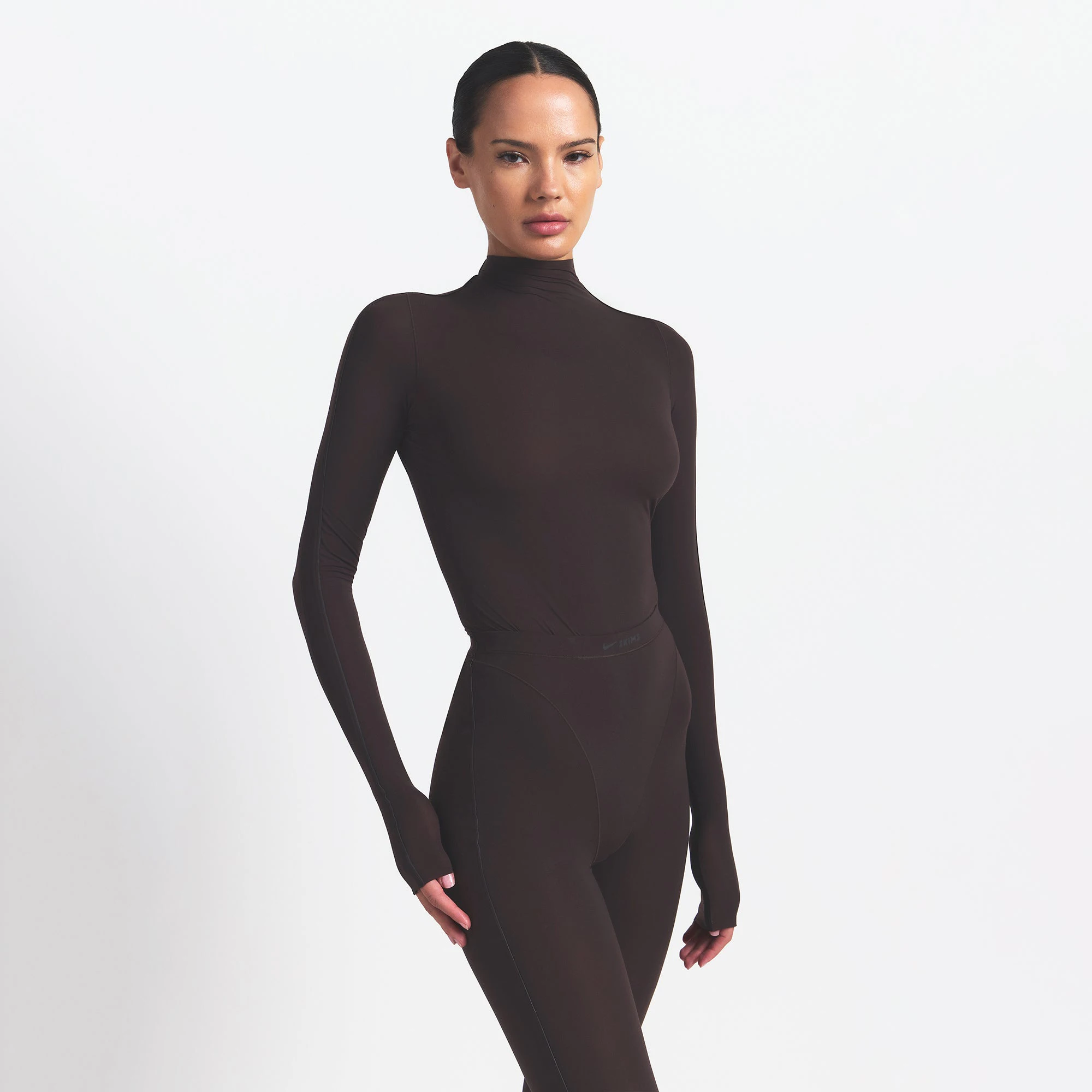 NikeSKIMS WEIGHTLESS LAYERS MOCK NECK LONG SLEEVE TOP | DARK ROAST ON A MODEL FRONT VIEW @ | FOCUS: 0.0, 1.0, 0.9