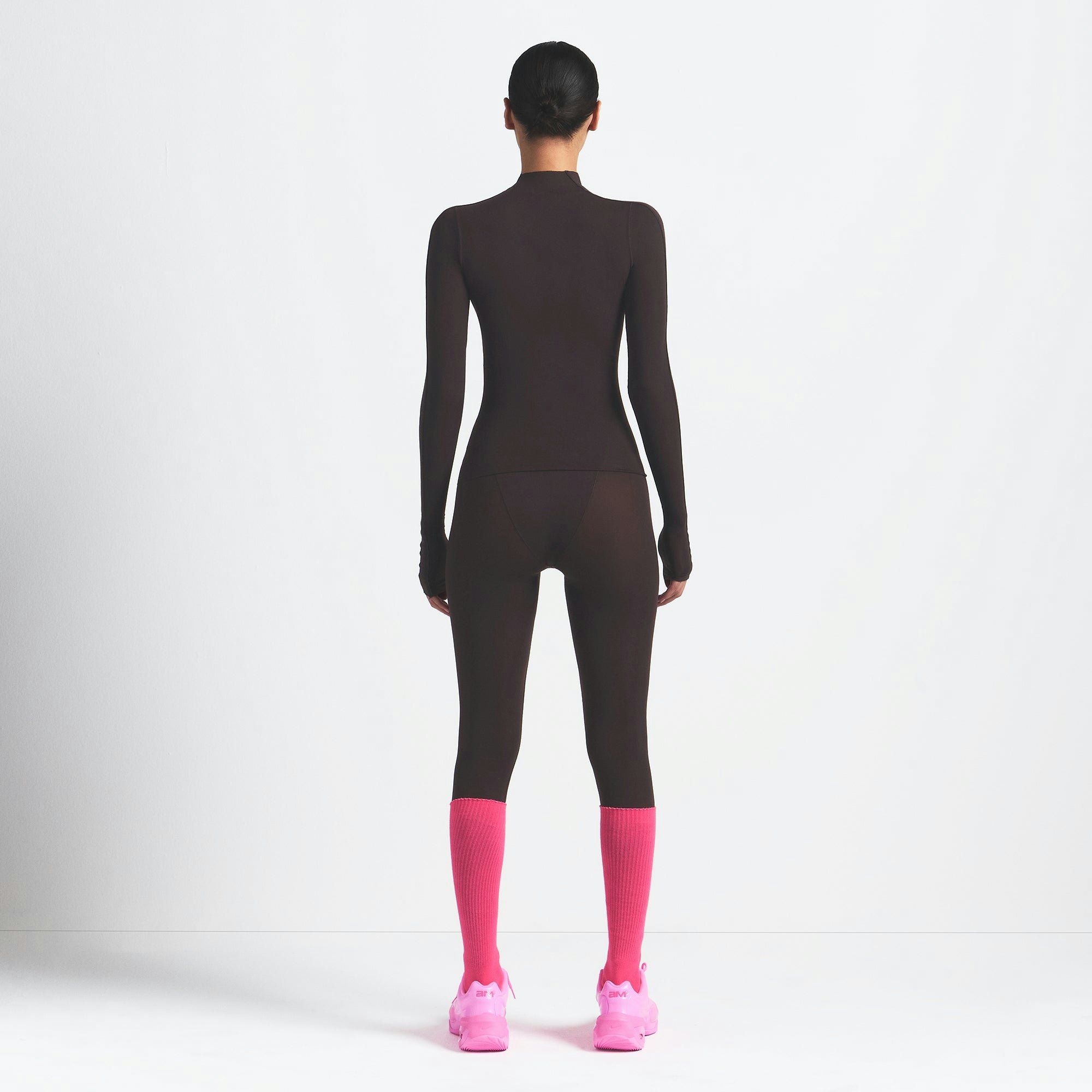 NikeSKIMS WEIGHTLESS LAYERS MOCK NECK LONG SLEEVE TOP | DARK ROAST ON A MODEL BACK VIEW @ | FOCUS: 0.0, 1.0, 0.9