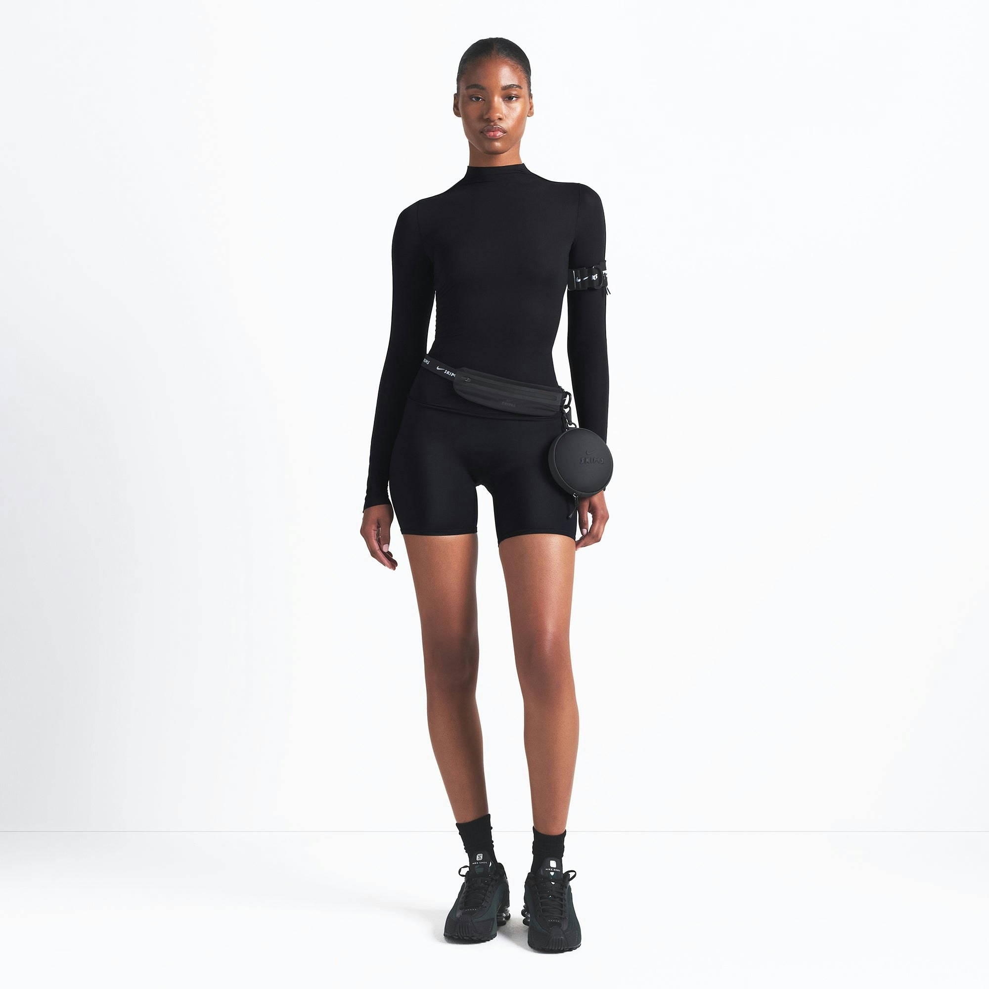 NikeSKIMS WEIGHTLESS LAYERS MOCK NECK LONG SLEEVE TOP | OBSIDIAN ON A MODEL FRONT VIEW @ | FOCUS: 0.9, 0.1, 0.7