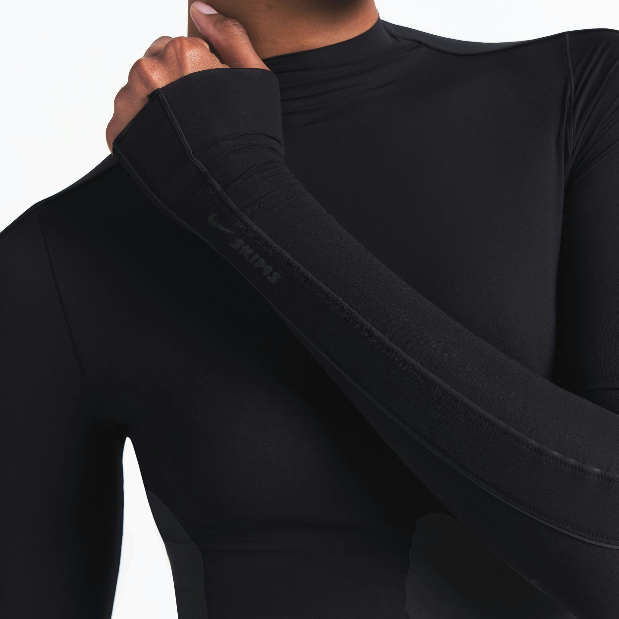 NikeSKIMS WEIGHTLESS LAYERS MOCK NECK LONG SLEEVE TOP | OBSIDIAN ON A MODEL FRONT VIEW